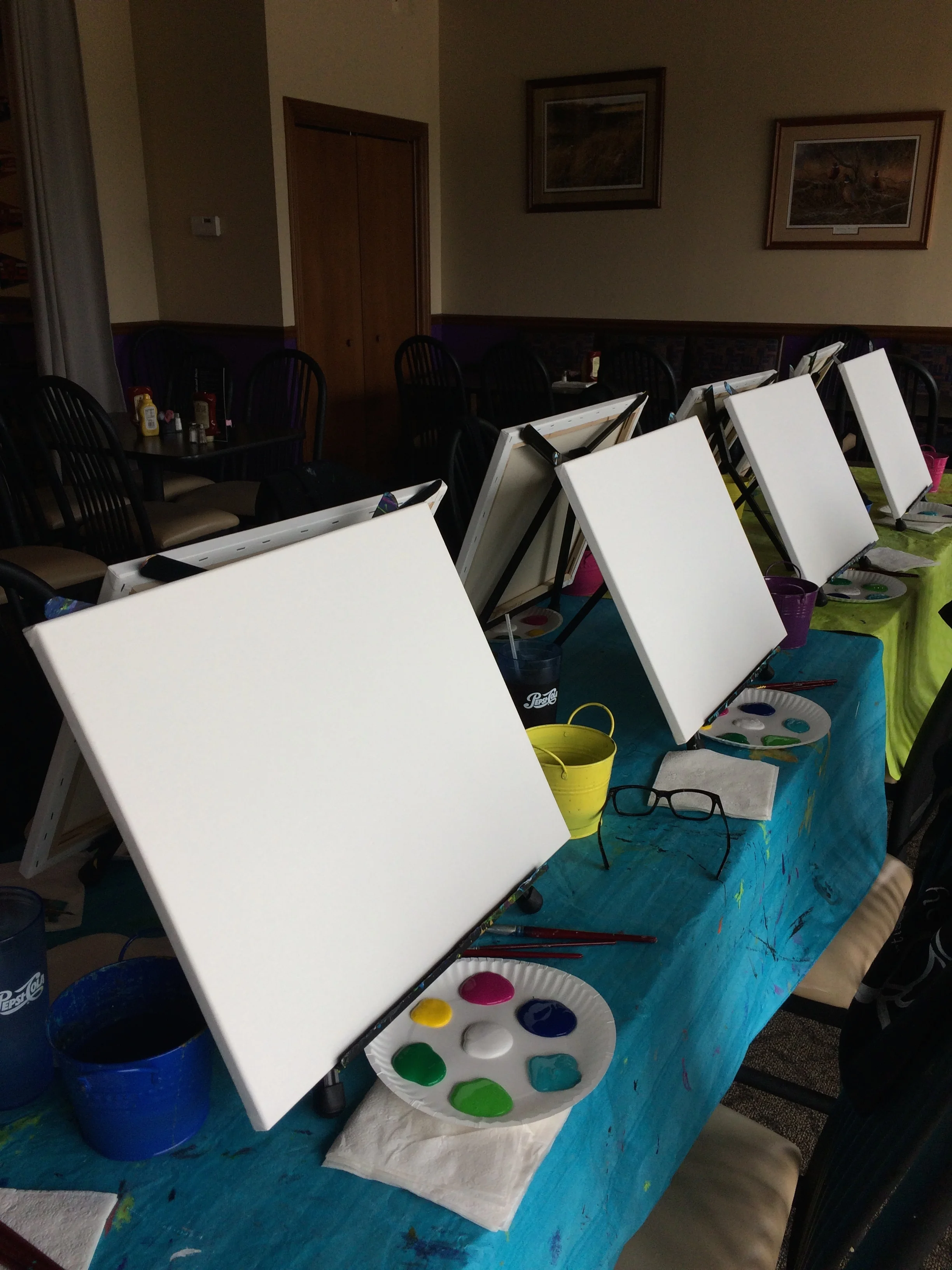 We bring the art supplies, table cloths, easels, canvas and aprons.