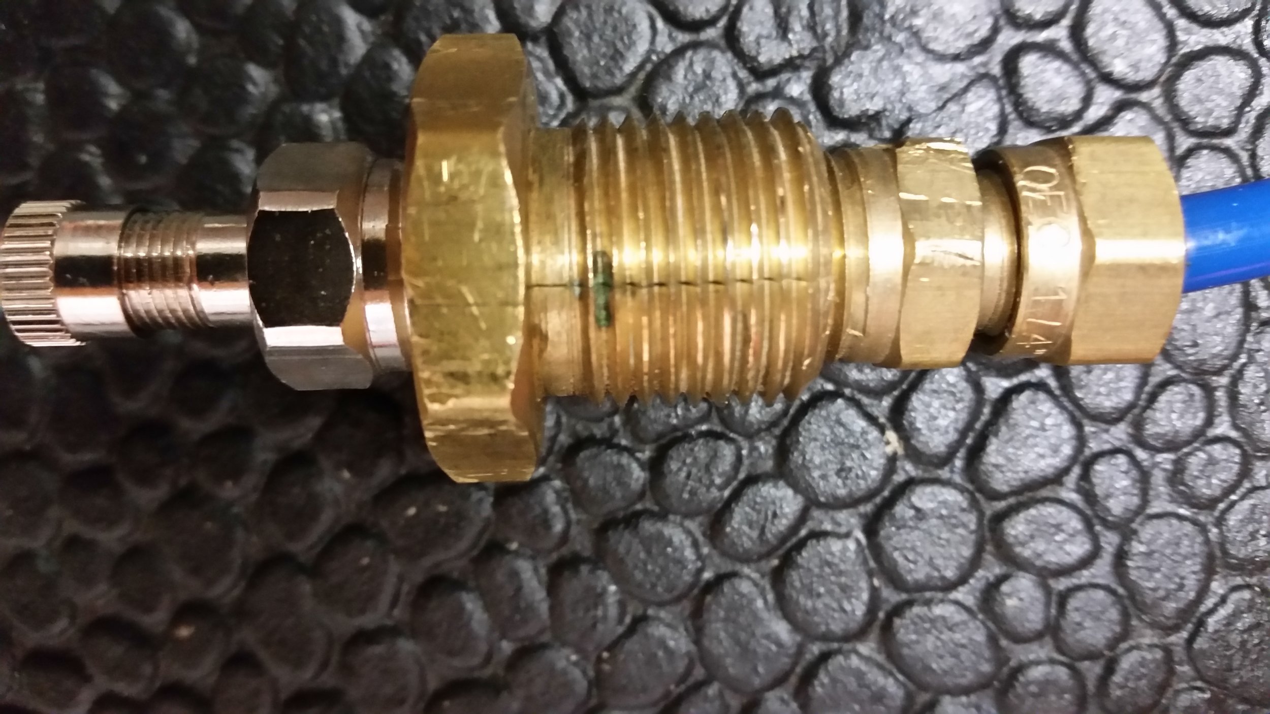 This crack in the standard air fill line was caused by over tightening the 1" nut. Only 16 foot pounds of torque is recommended by the manufacturer. Please use caution with a 1" wrench. This setup was discontiued 03 August 2017.