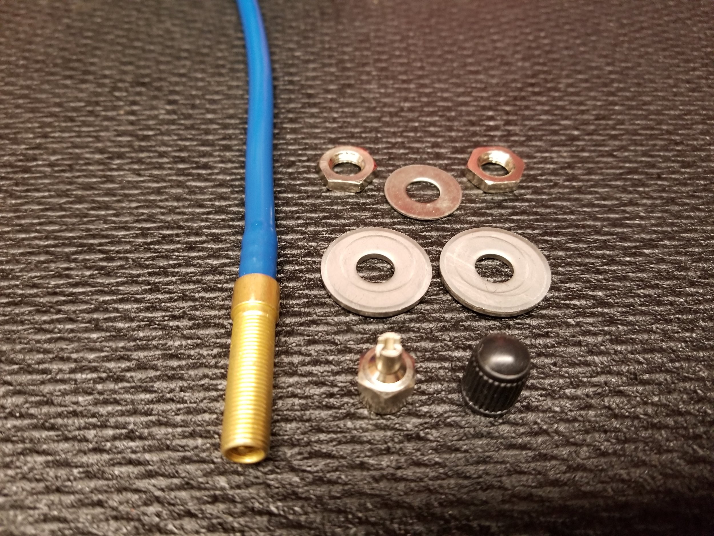 New (Standard) Barbed Air Fill Schrader Valve. Started shipping 04 August 2017 in all kits.