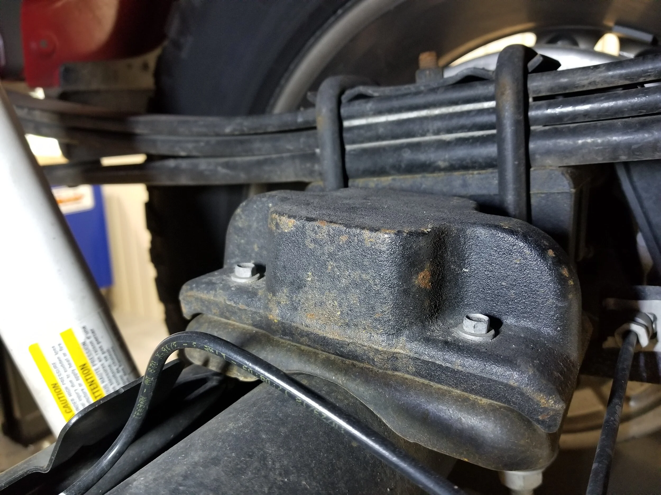If your truck has these blocks bolted to the axle, the 2” air spring upgrade is required when ordering.
