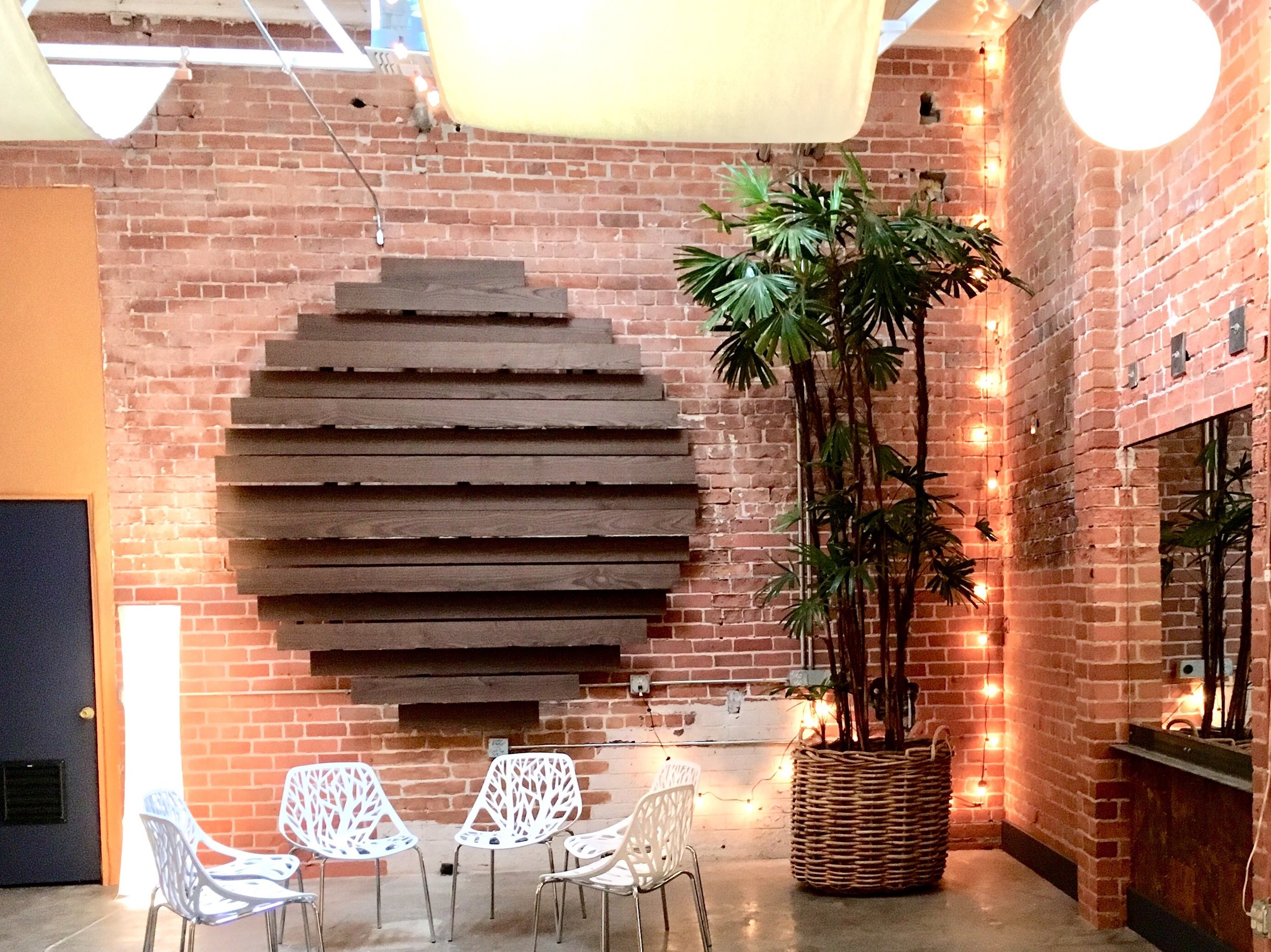 I designed and built this studio in downtown Tucson. The wood wall feature is made from thermo-treated Ashwood from Indiana.