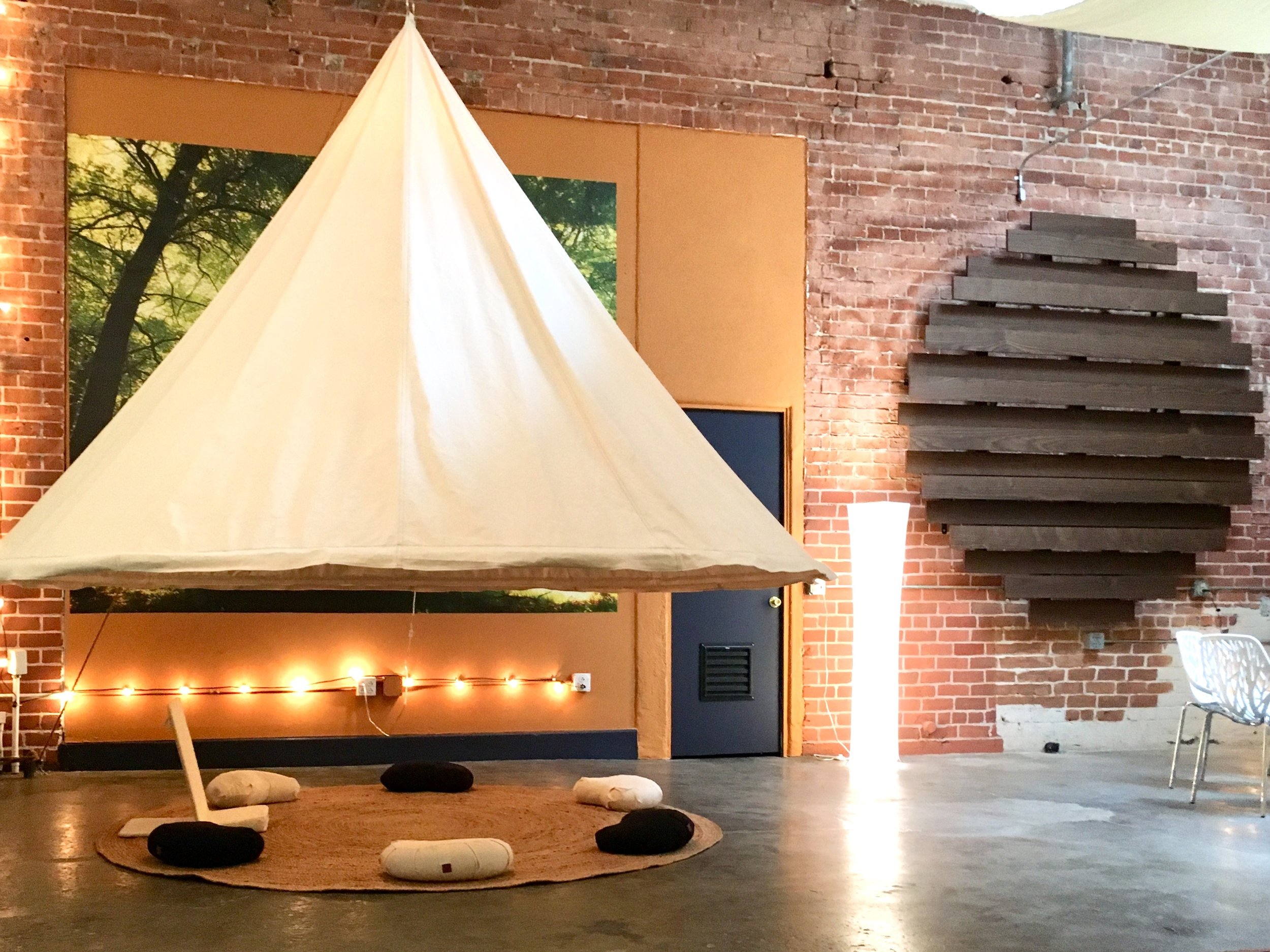 I designed this suspended "conceptual tipi” and Josh from Wrought Canvas in Colorado sewed it for me.