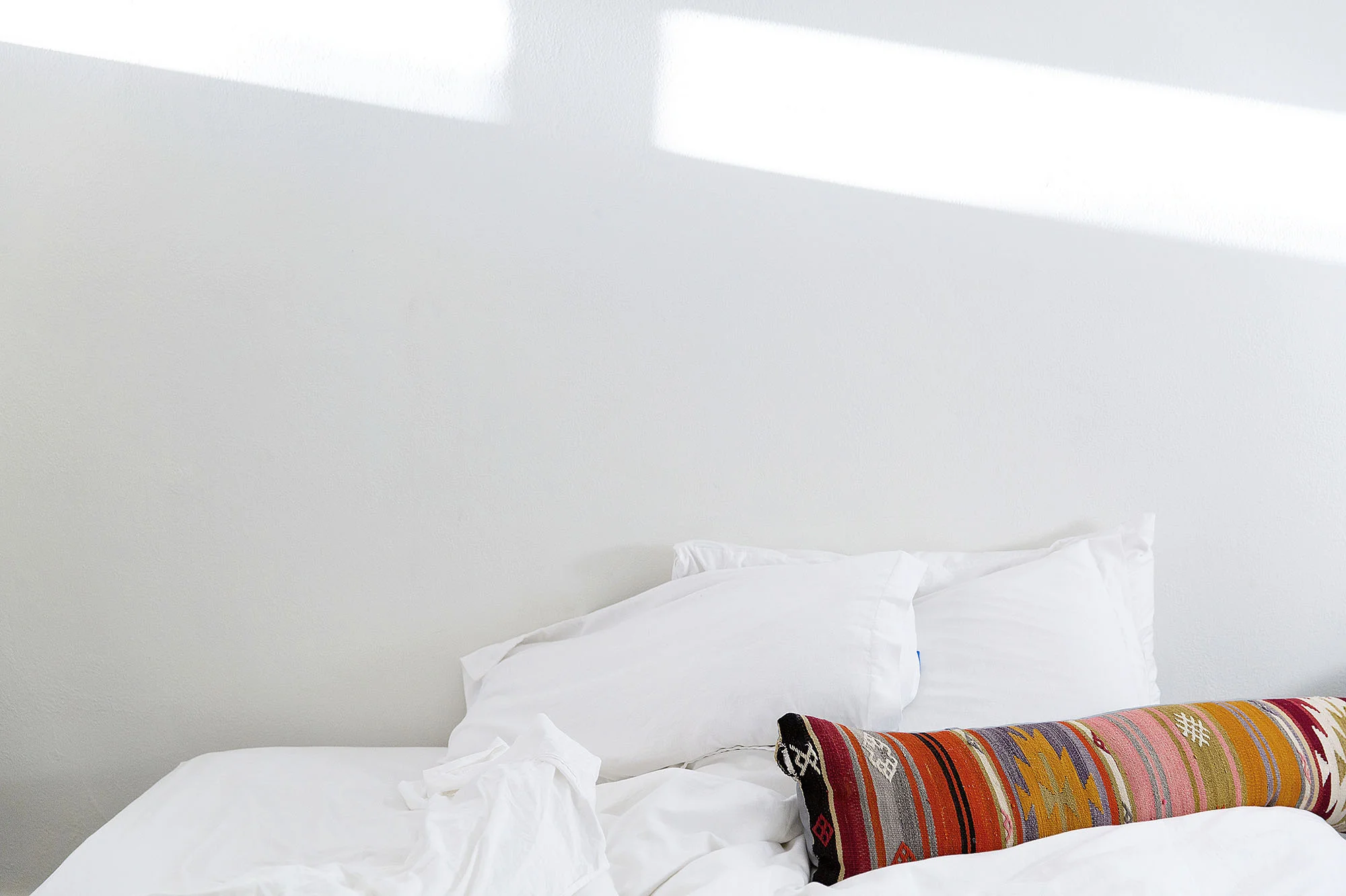 Bed in Palm Springs, California by Rebecca Stumpf