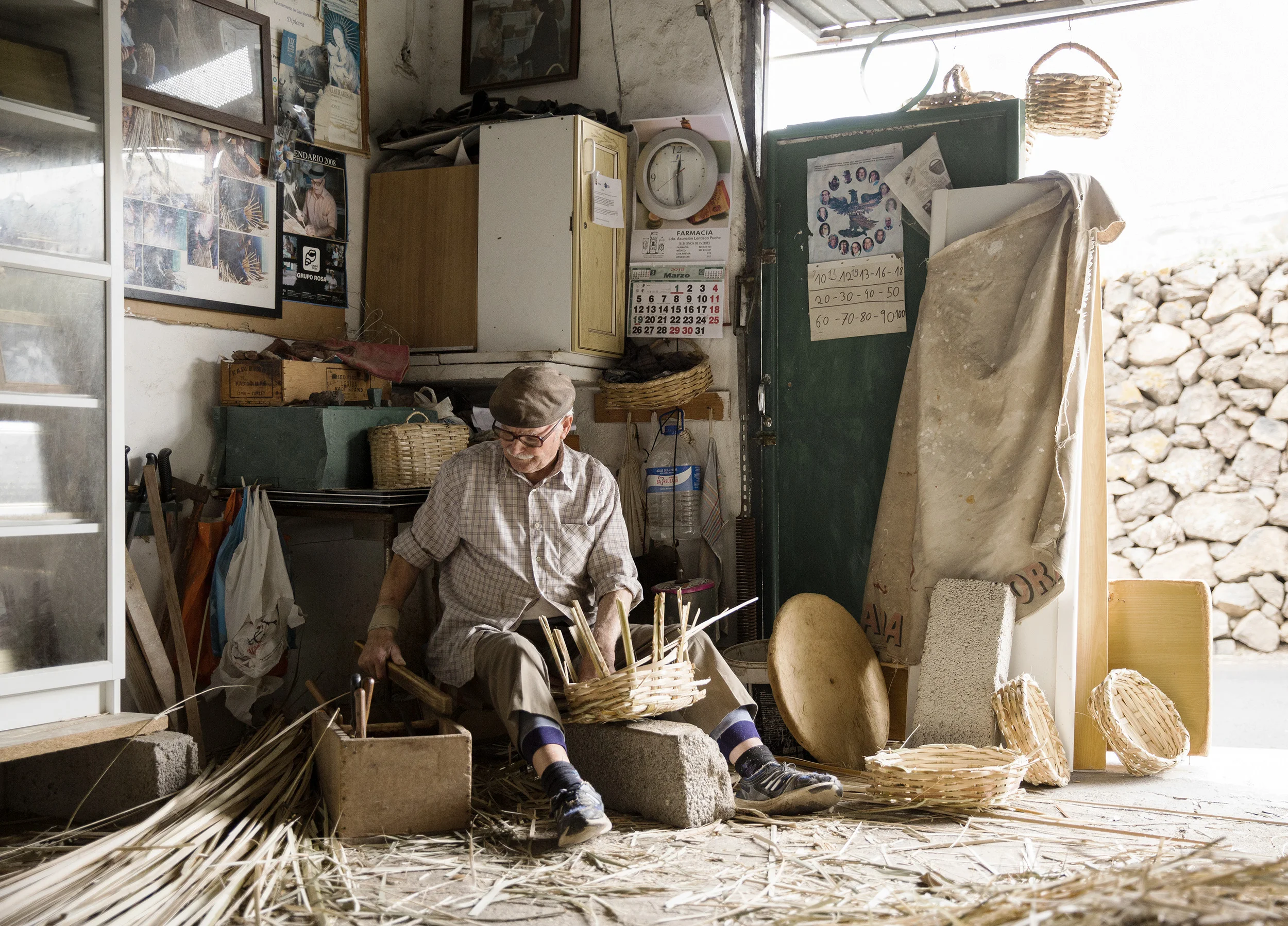 A man weaves baskets in his studio on Lanzarote in the Canary Islands by Rebecca Stumpf, Denver Boulder Colorado Editorial and Commercial Photographer.