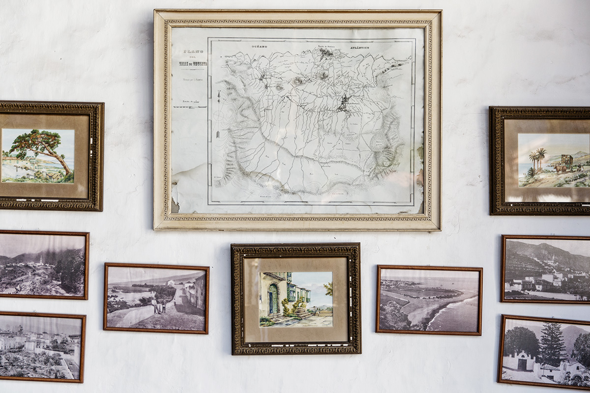 Old photos and a map from early Canary Islands history on a wall by RebeccaStumpf.Food.Travel.Lifestyle.Denver.Boulder.Colorado.Photographer