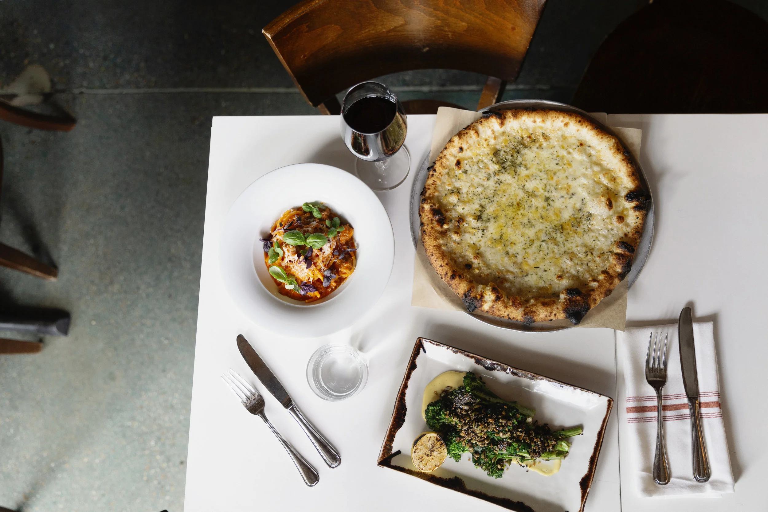 Pizza and other food items at Bar Dough in Denver by Denver Colorado Editorial Photographer Rebecca Stumpf