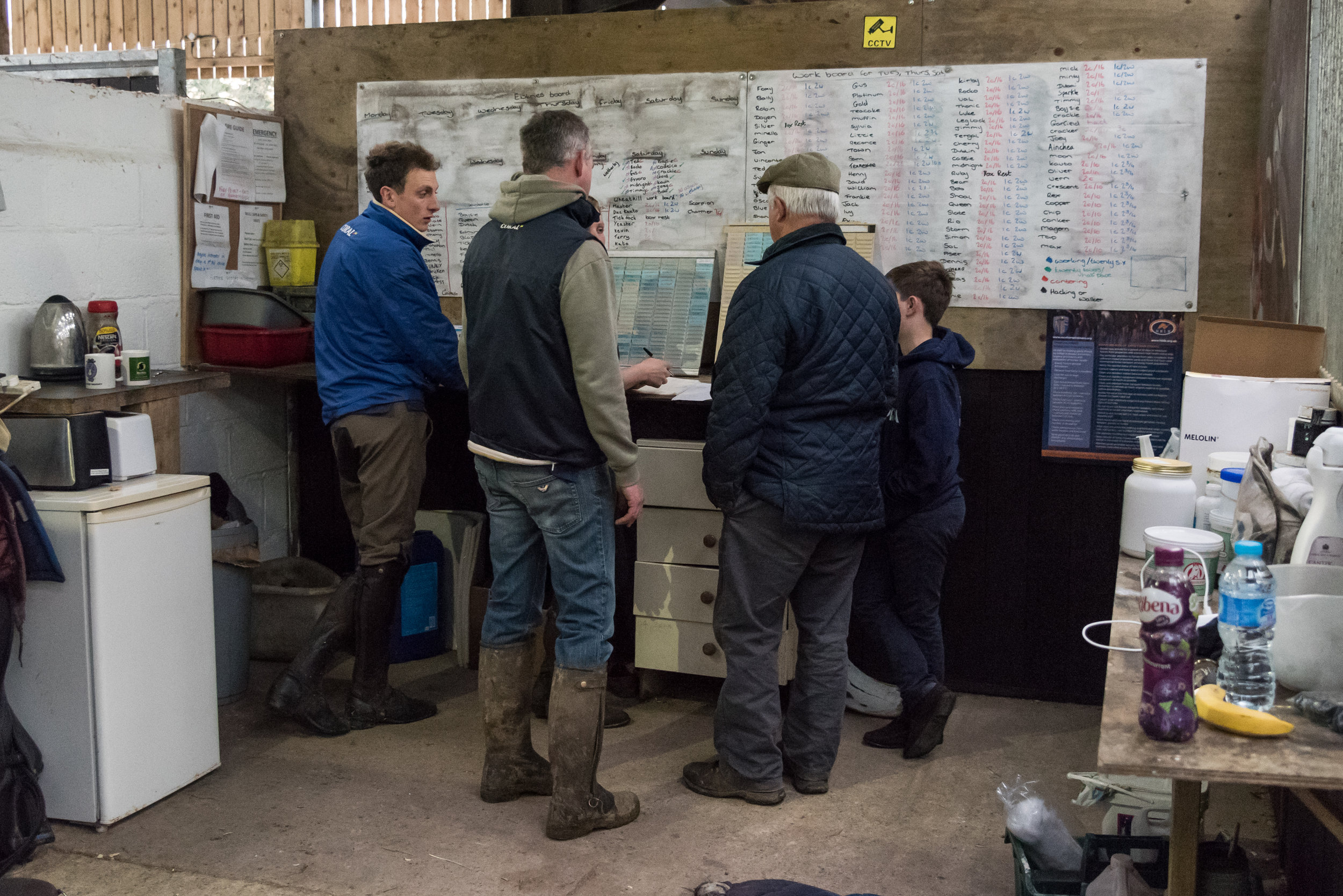 Three generations of the Tizzard family make plans for morning work.