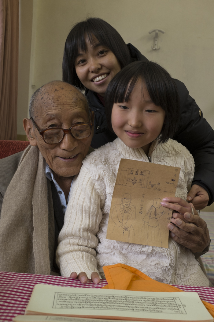 Our little friend and mother with a drawing of Rinpoche and me.