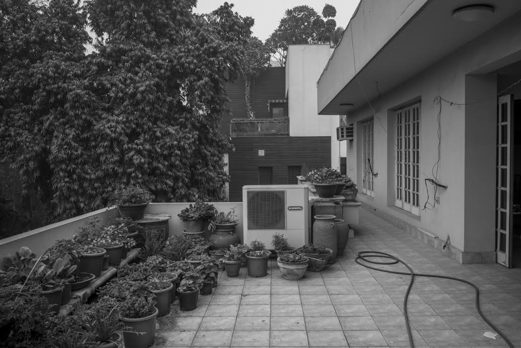 I lived very comfortably in the rooftop flat of my godfather's home...