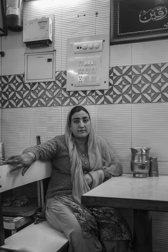 and a Kashmiri lady await her tea beside the grand Jama Masjid