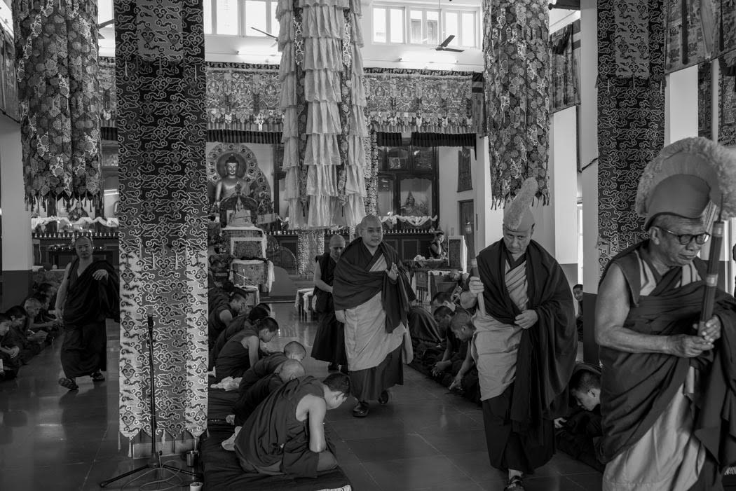 The monks bow as we lead Rinpoche out