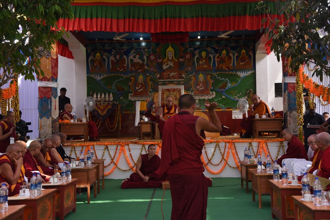 Rato monks debate before His Holiness as well as Ganden Trisur Rinpoche, Jangtse Choeje Rinpoche, Ling Rinpoche, Kundeling Rinpoche and the abbots of the great Tibetan Monastic Universities and Tantric Colleges. Photo by Tanya Agarwal
