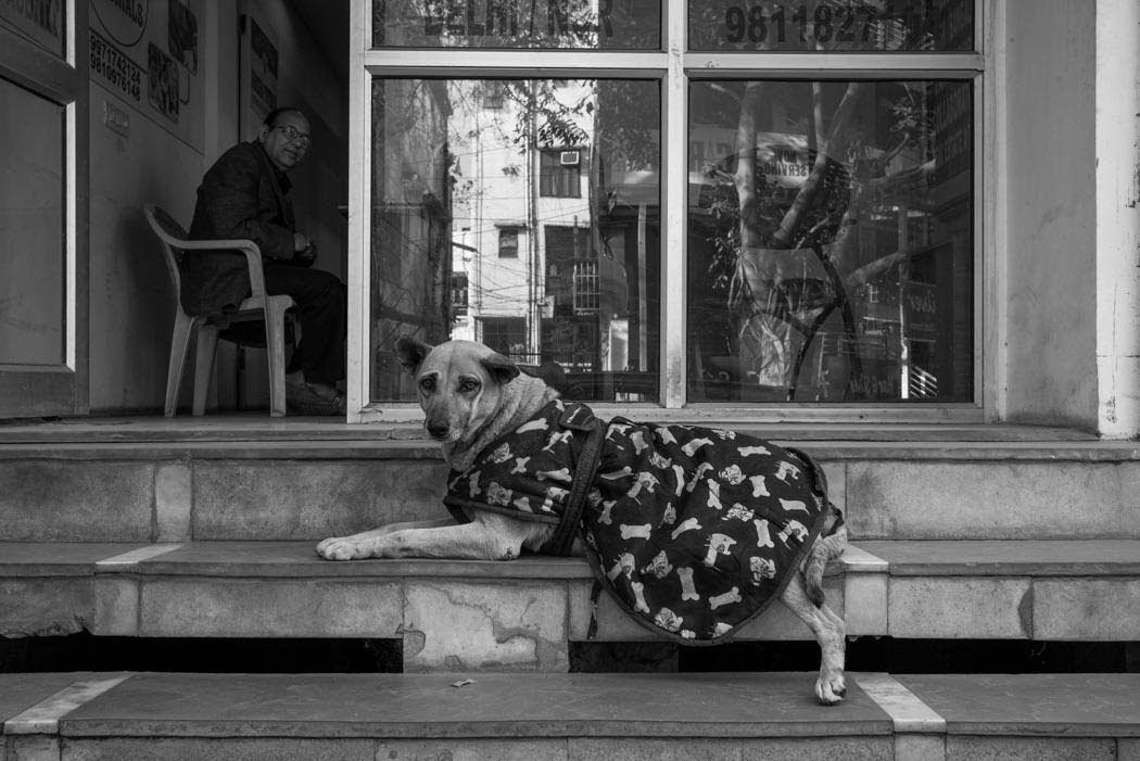 though we wear a coat