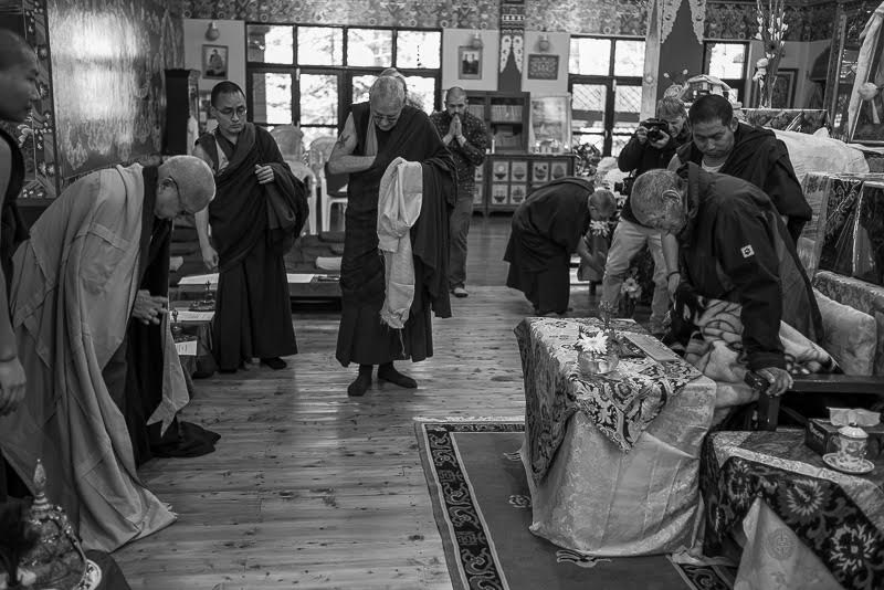 Zopa Rinpoche makes prostrations which Khyongla Rinpoche stands for