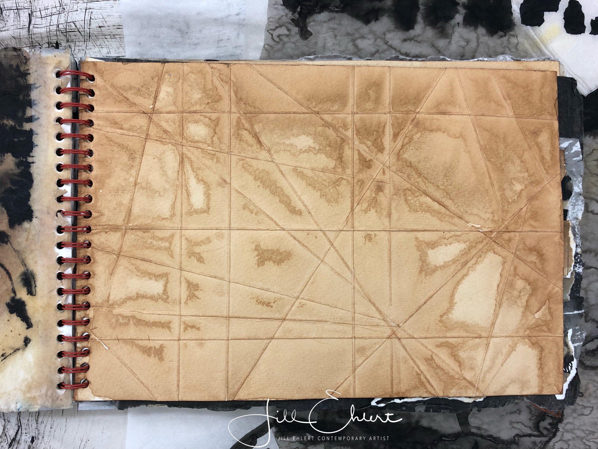 Folding and creasing paper. Tea stains.