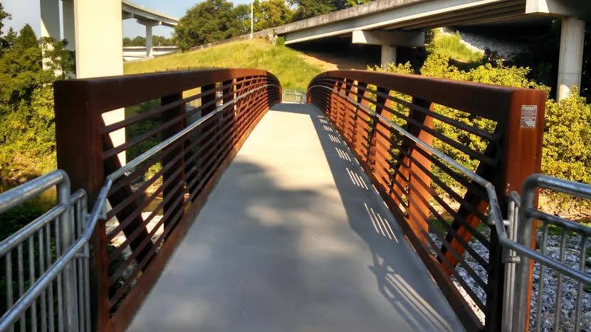 The remarkable bridge crossing the creek on the Cheshire Farm Trail