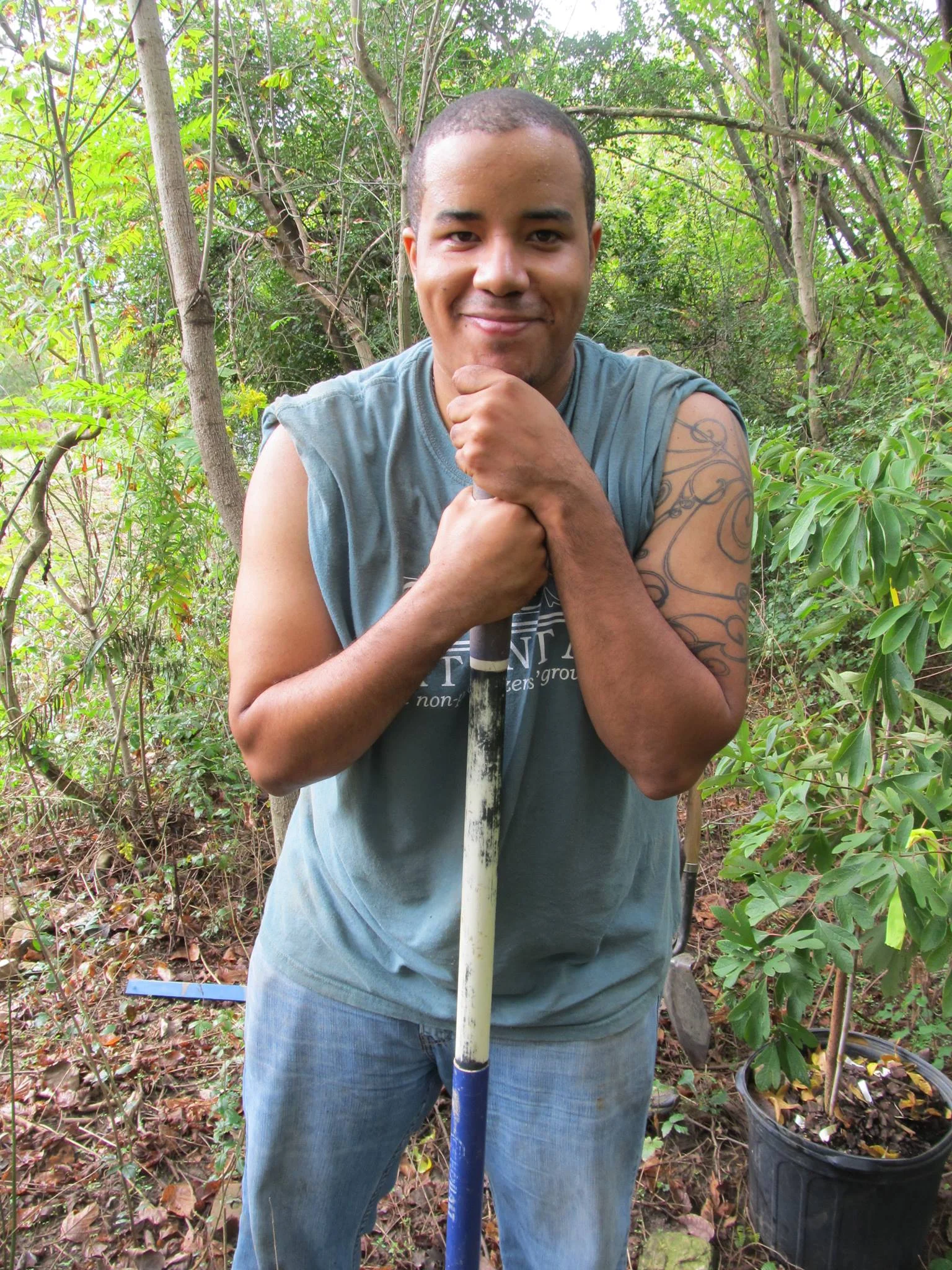 Justin Thomas planting saplings on the trail in fall 2013