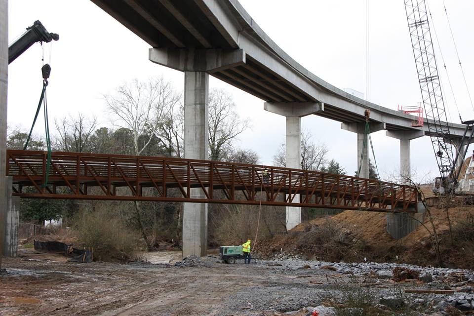 DOT's latest schedule shows the ramps opening in March. The pedestrian trail opens shortly afterwards.