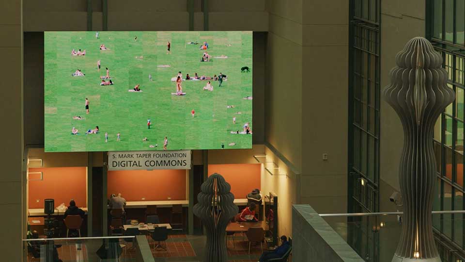   Installation view of "Green Play" on the 28 foot video wall in Los Angeles Public Library  