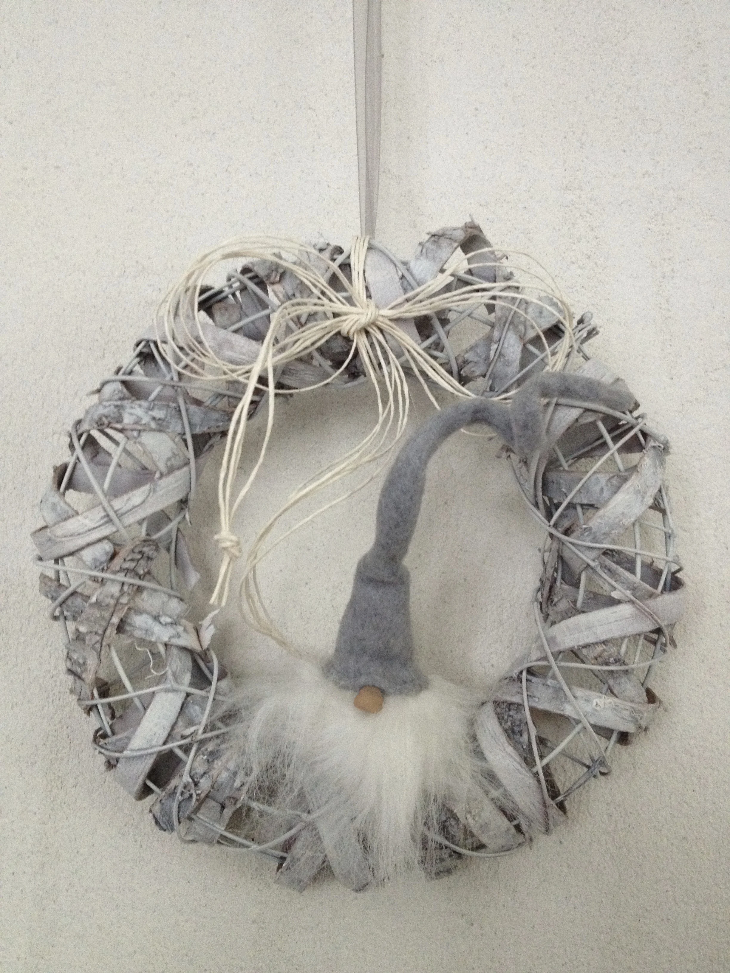 Elves are everywhere in Scandinavia. I found this very cute one sitting on a Christmas wreath.