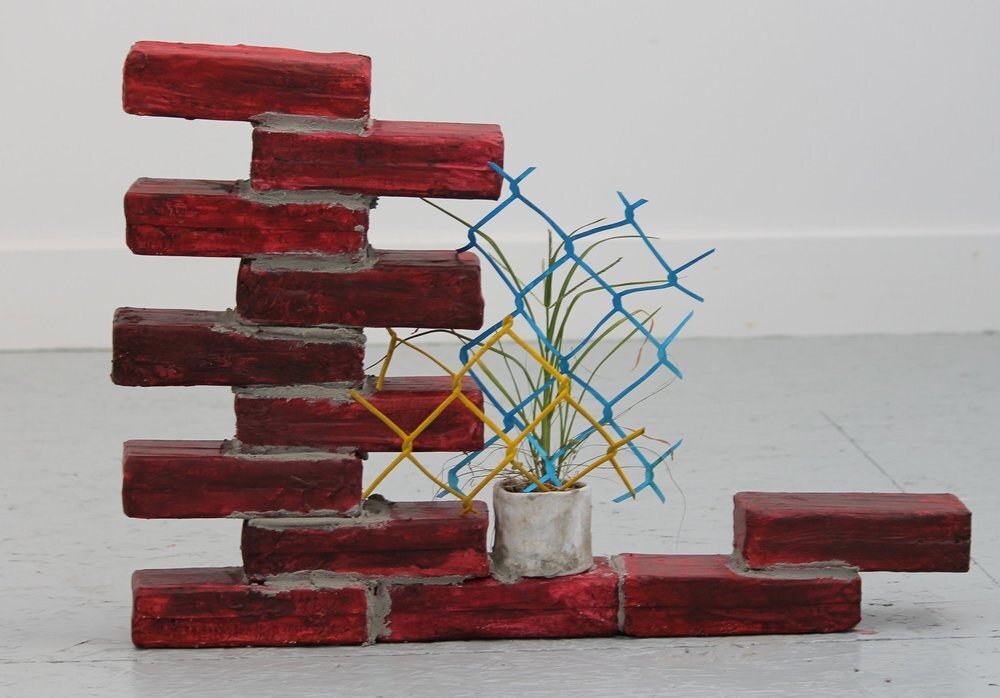   Twelve Bricks, 2014   Paint, foam, paper, clay and plant, approximately 15 inches x 15 inches 
