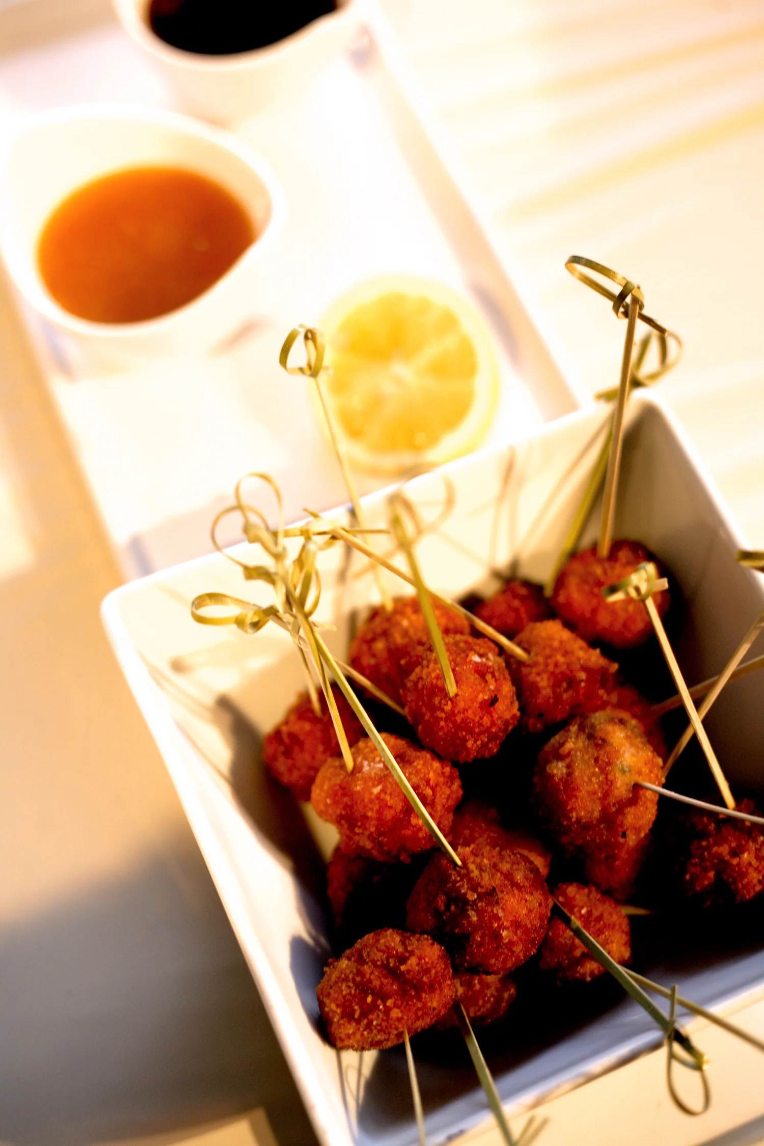 Chicken bacon croquette with apricot horseradish and sriracha-maple mustard dipping sauces