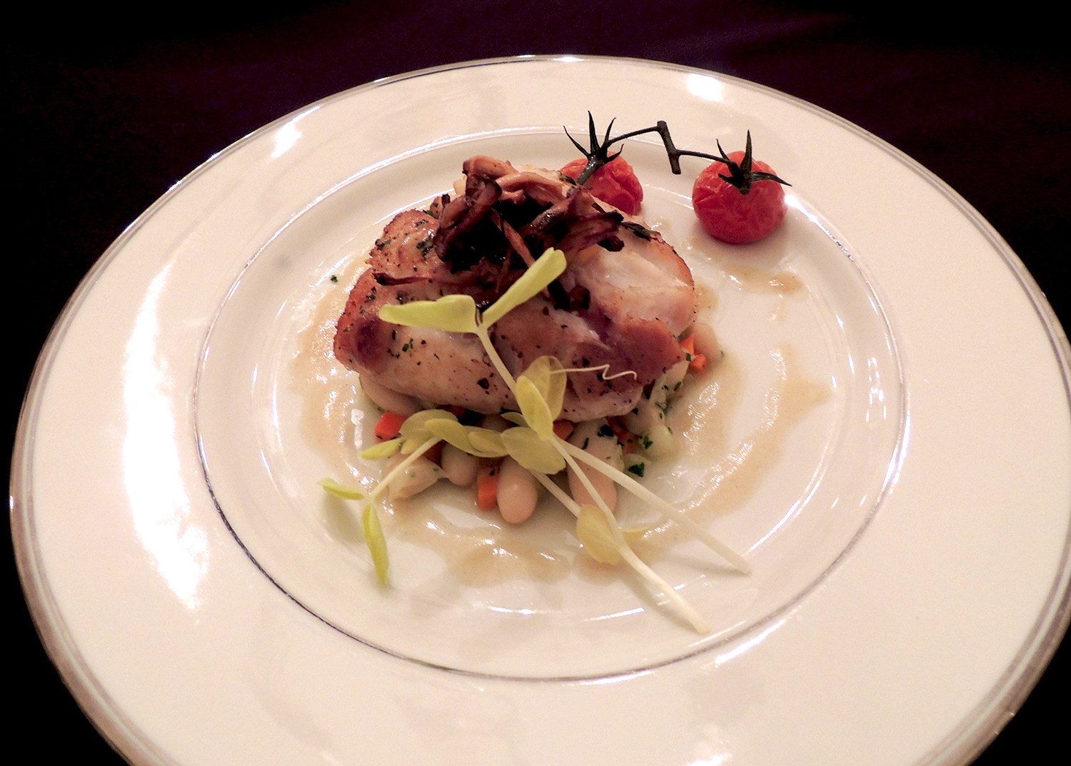 Seared blue nose sea bass, cannelini bean-cherry tomato ragout, chanterelle mushrooms