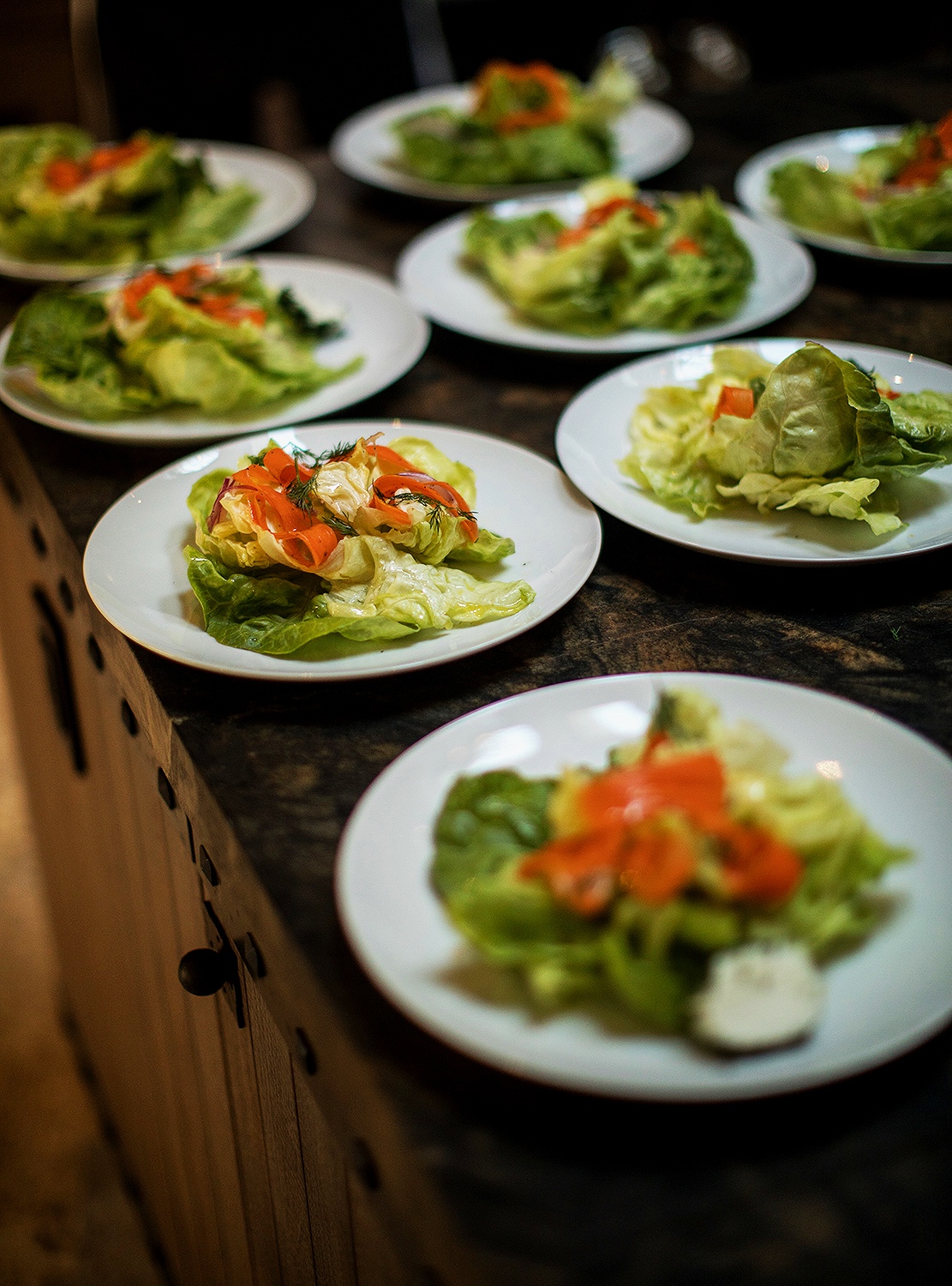 Bibb lettuce salad with carrot, red onion, herb cheese, and dill