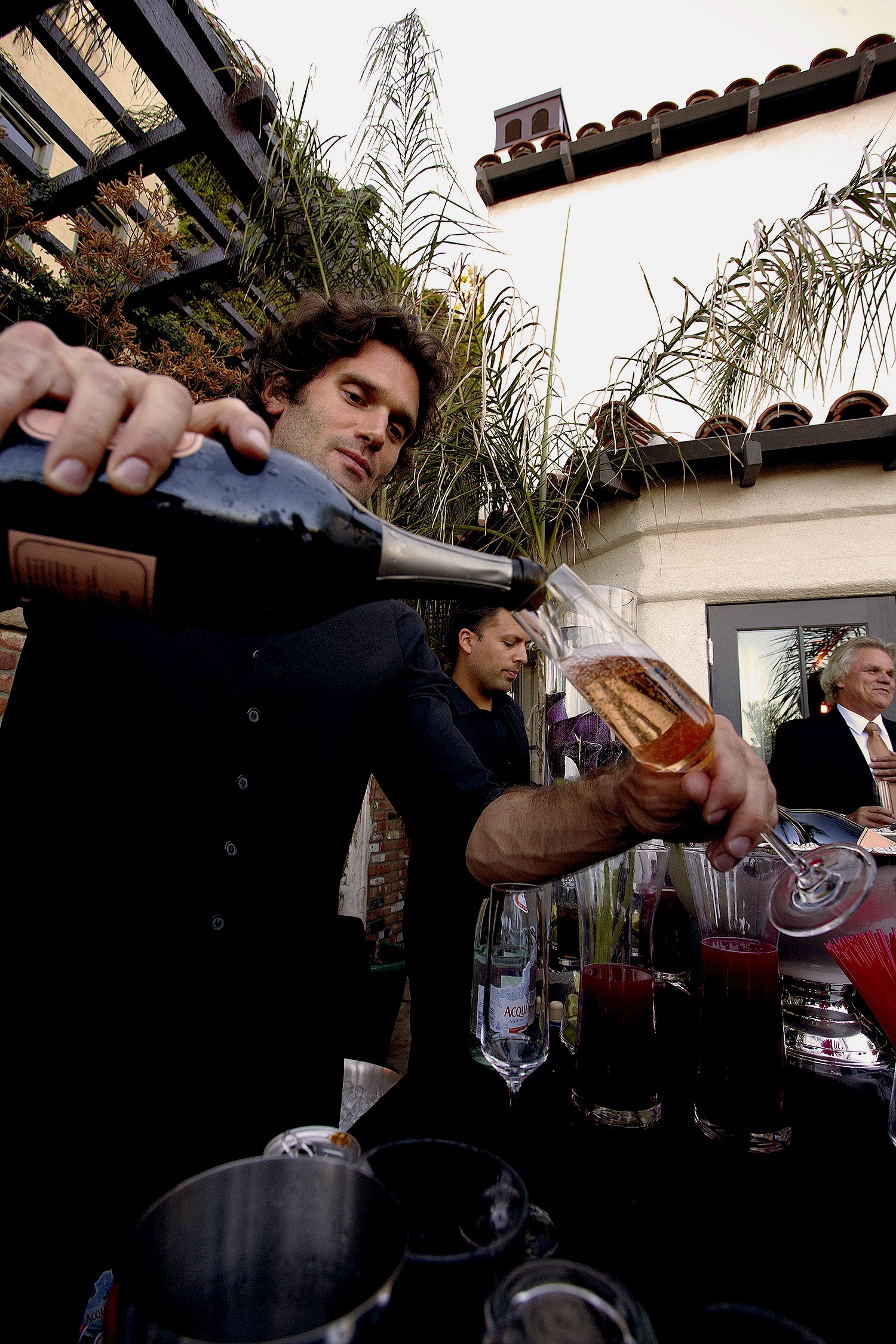 Bartender pouring champagne