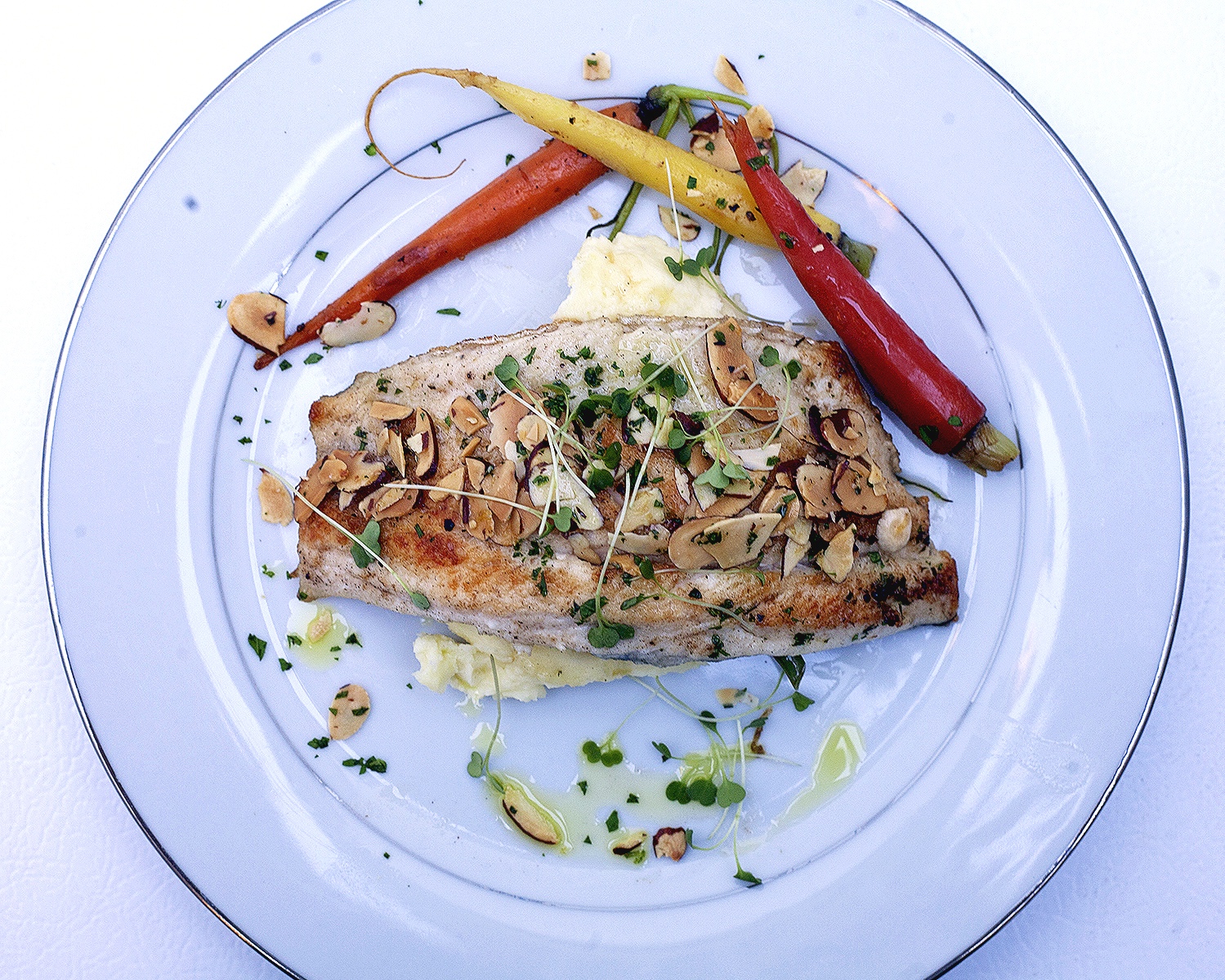 Almond crusted sea bass with roasted heirloom carrots