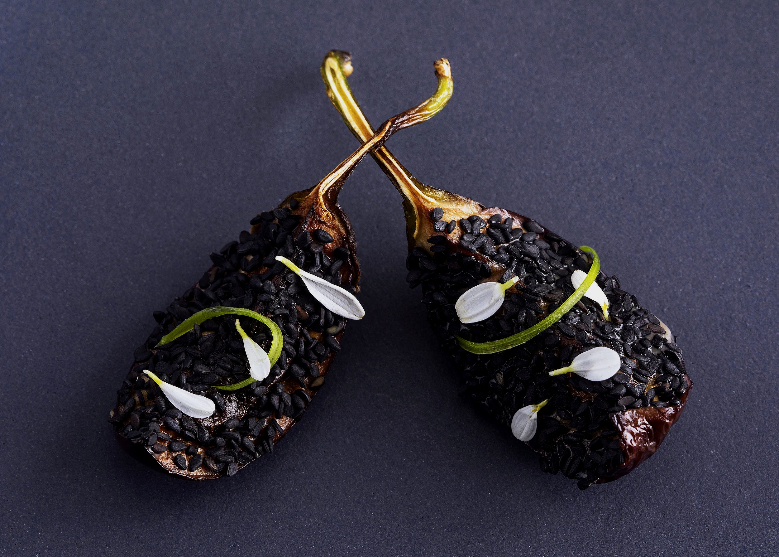 Baby eggplant with sesame seeds, miso glaze and white micro flowers
