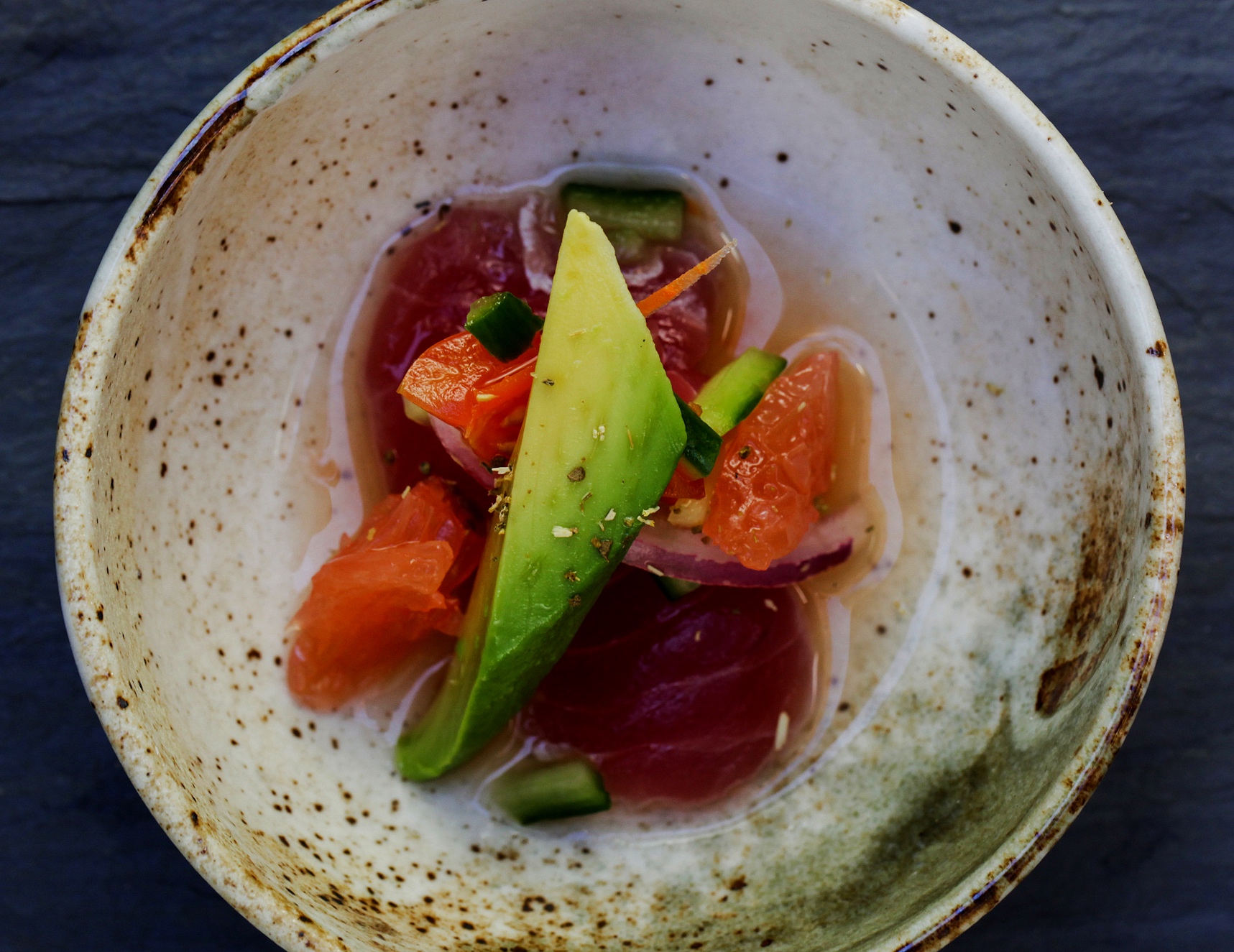 Ahi tuna ceviche with grapefruit, cucumber, avocado and red onion