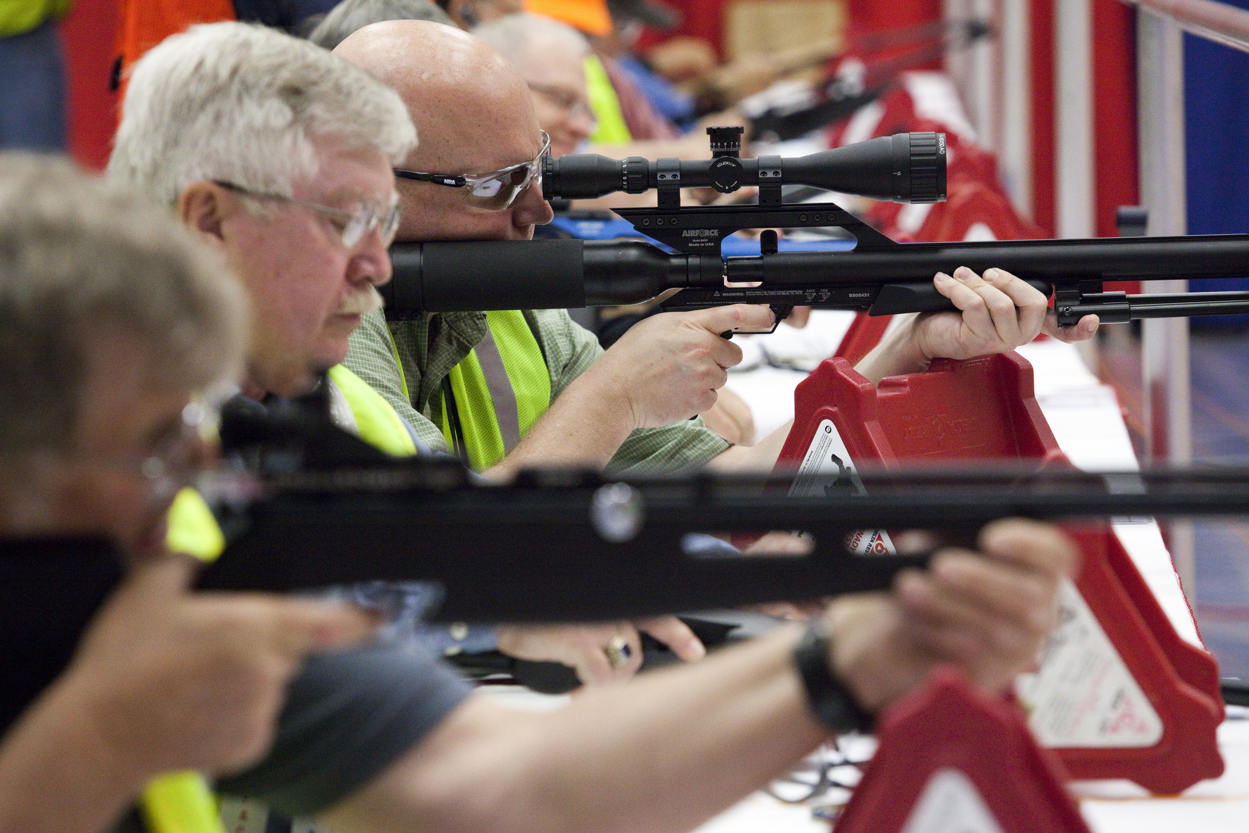  Volunteers sight air rifles at the Pyramyd Air air gun indoor shooting range at the 2013 National Rifle Association Meeting and Exhibits May 2, 2013 in Houston. Instructors were available for those willing to pay the $1.00 fee for five shots. 