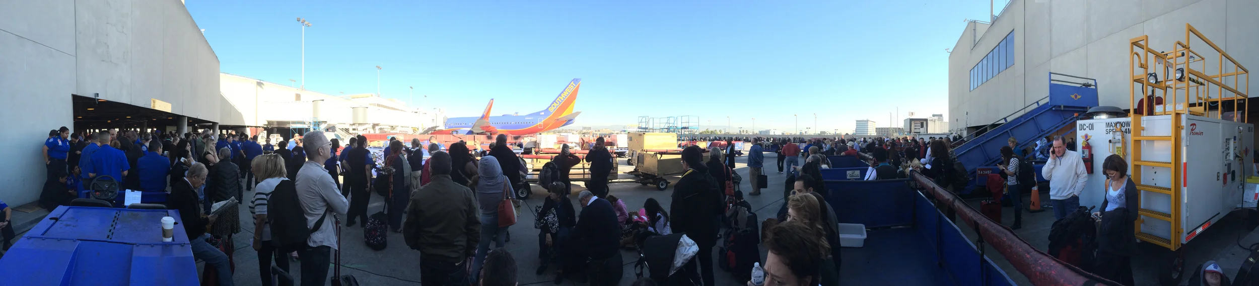 Passengers wait outside terminal one of the Los Angeles International airport eventually being moved to the international terminal following a shooting in terminal three Nov. 1, 2013 in Los Angeles, CA.