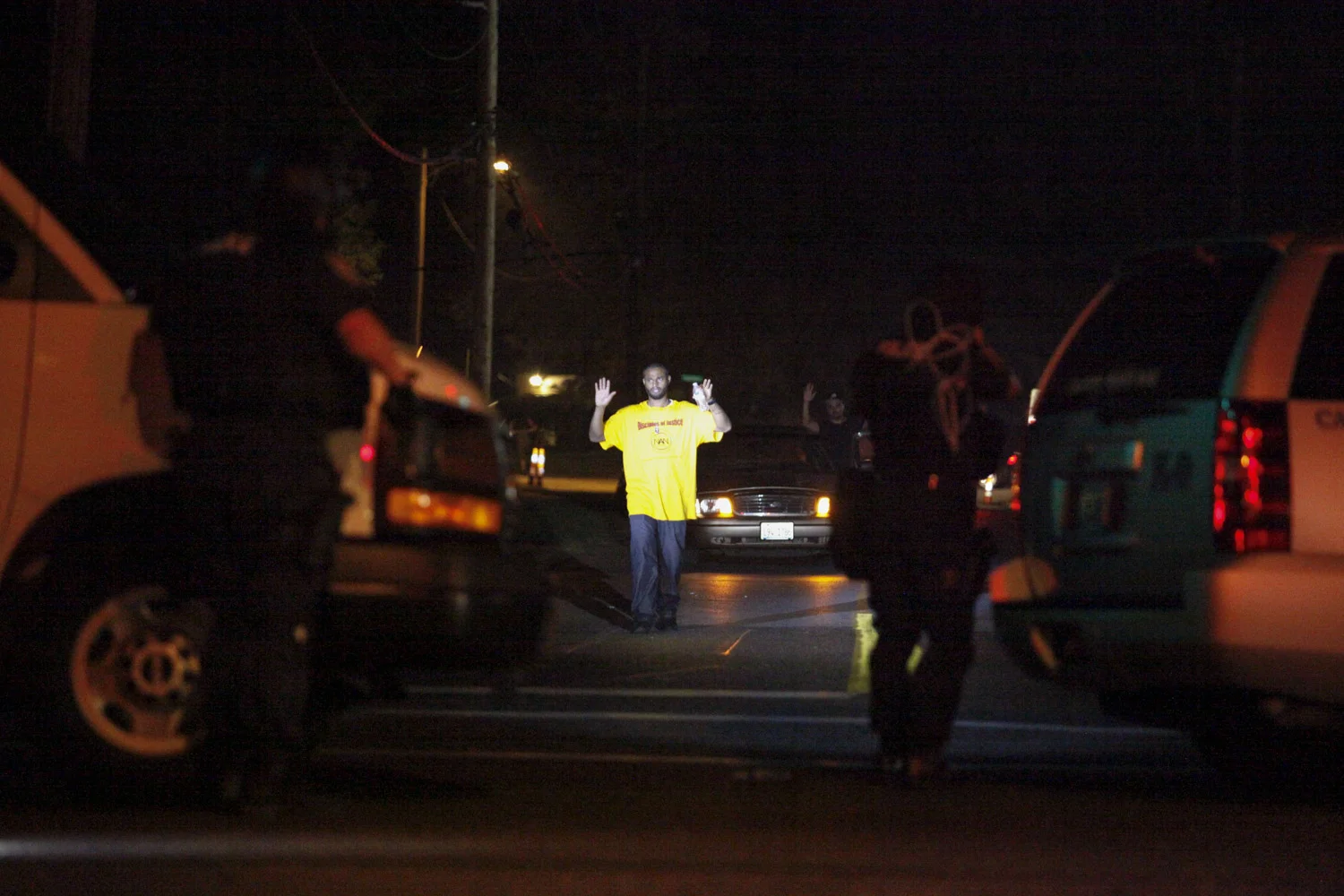 A man is directed toward police after shots were fired at law enforcement moments earlier.