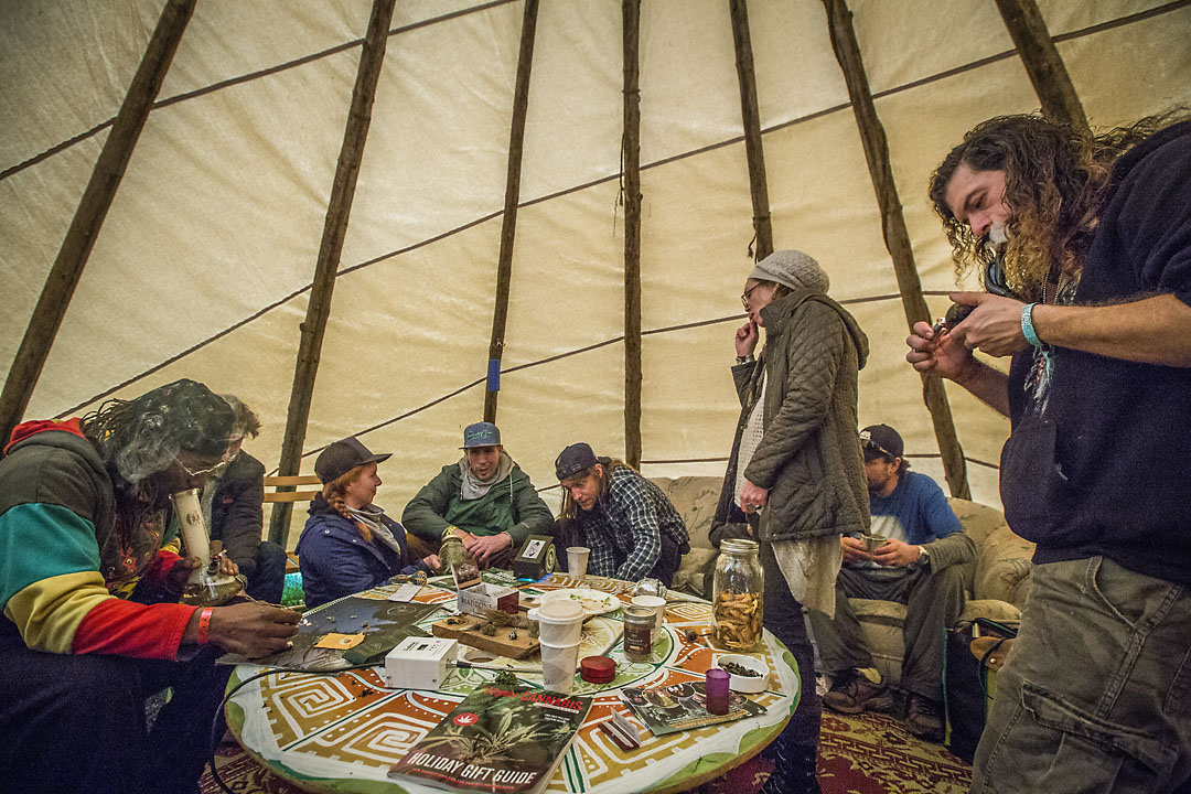  Friends gather inside a teepee to smoke and relax inside a teepee at the Emerald Cup. 