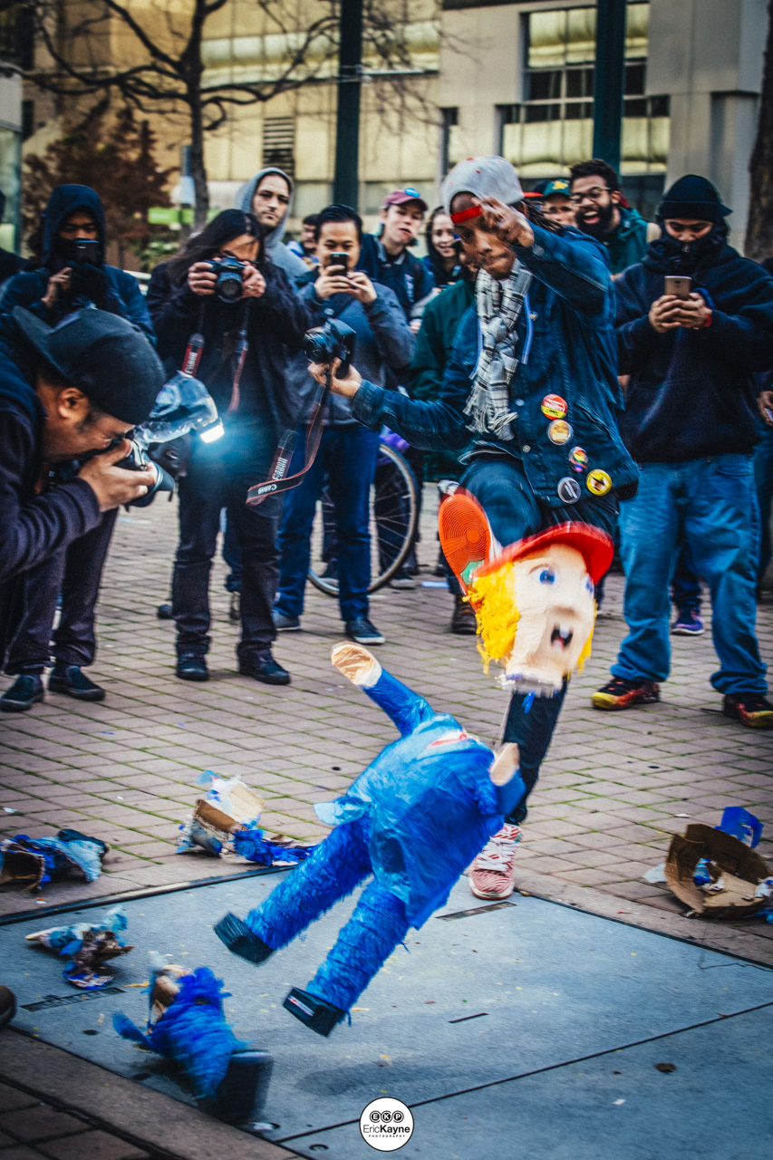  A protestor kicks a Donald Trump piñata at an anti-Trump rally marches into downtown Oakland, Friday, Jan. 20, 2017 in Oakland, CA. 