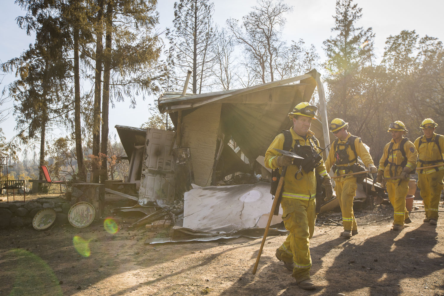  Firemen search for hotspots on Jan Hoyman's property destroyed by wildfire in a secluded neighborhood off Tomki Road Oct. 15, 2017 in Redwood Valley, CA. 