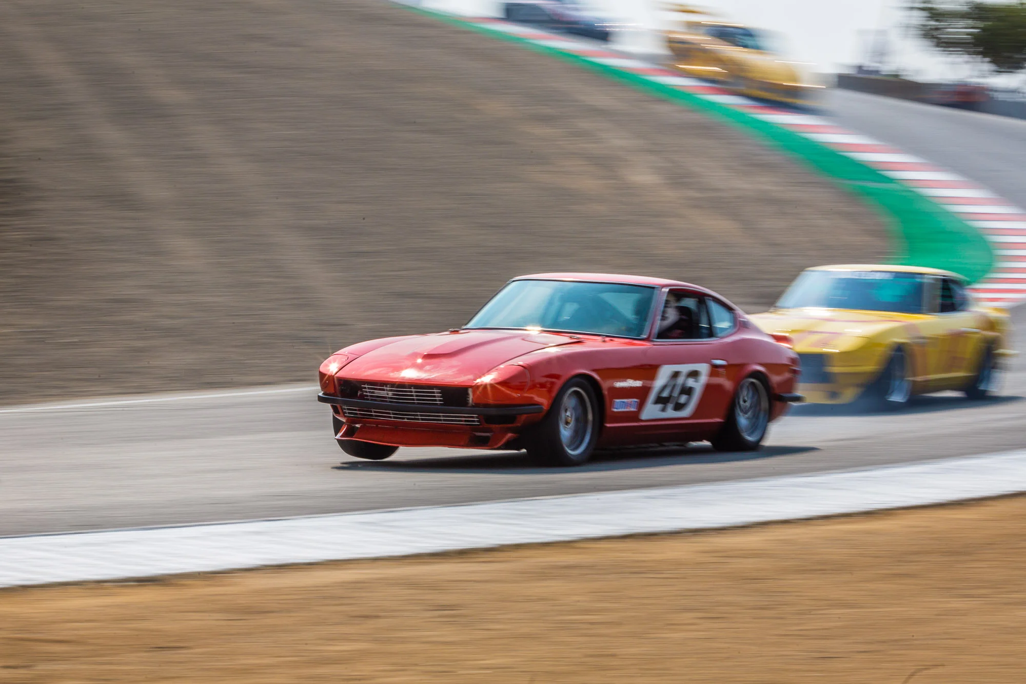 A Datsun 240Z at the Rolex Monterey Motorsports Reunion drives through the corkscrew section at Laguna Seca in Salinas, Calif. on August 25, 2018. (Eric Kayne/AP Images for Nissan)