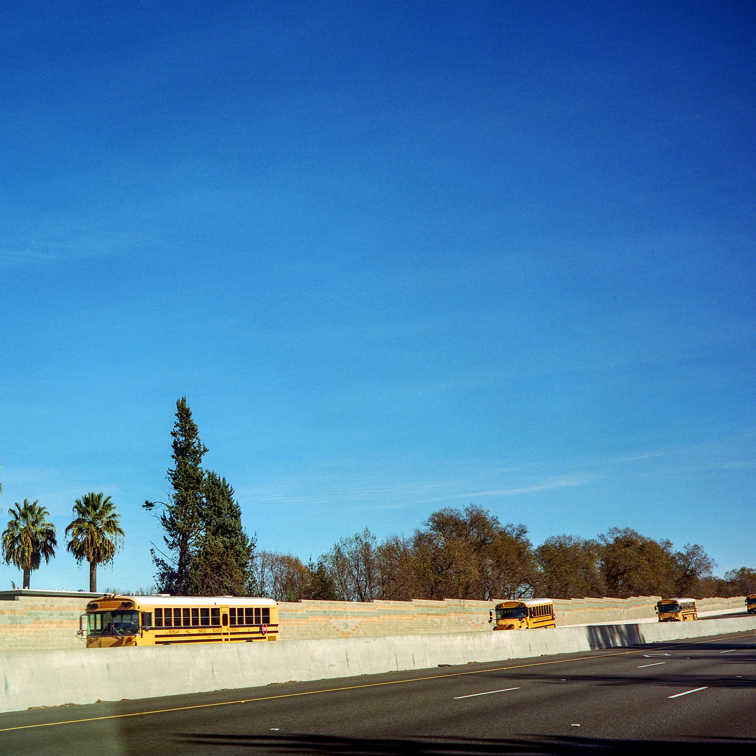 Buses traveling back from the sierras to a school district near San Jose.