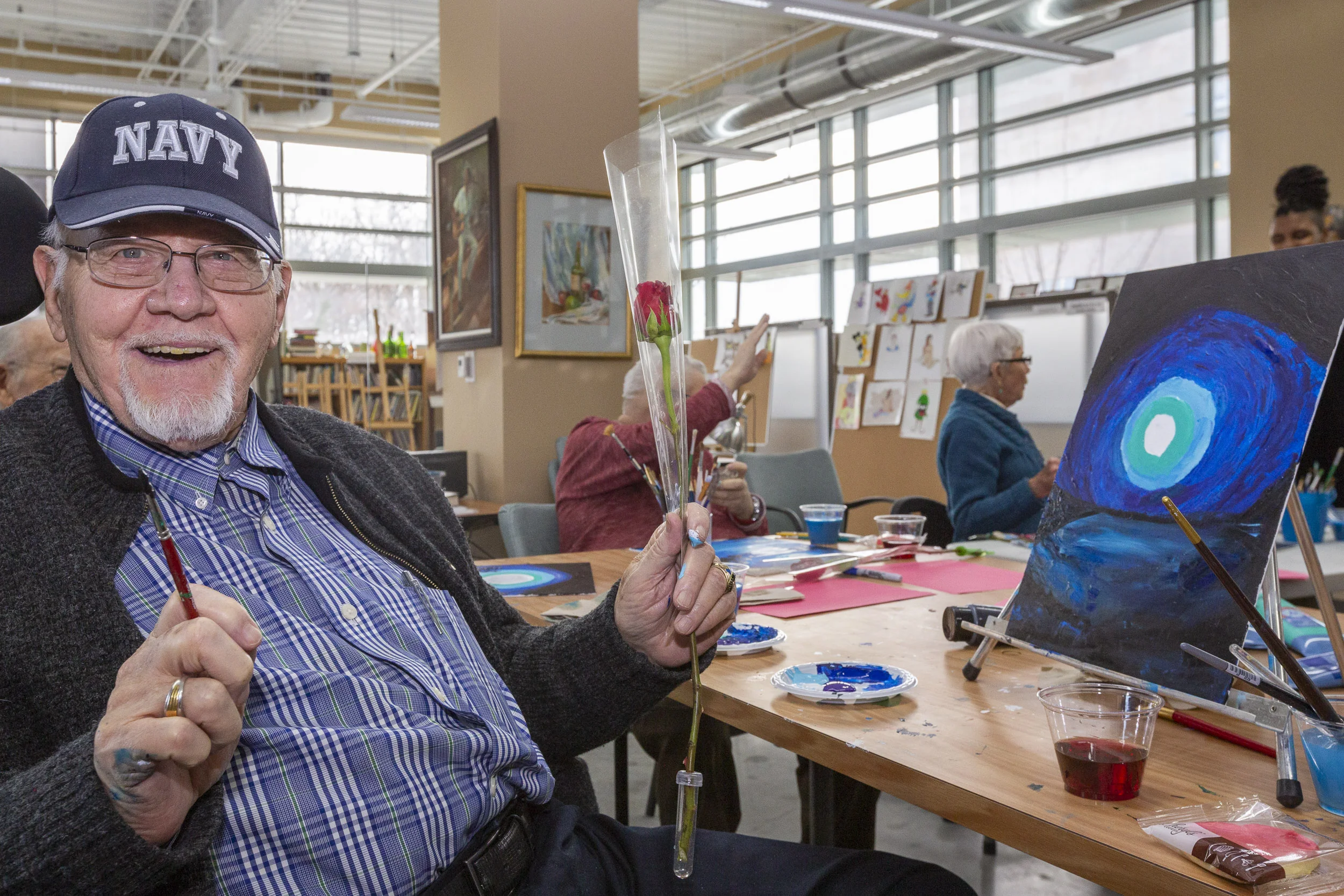 A military veteran delights in a rose from 1-800-Flowers.com at the Armed Forces Retirement Home on Valentine’s Day on Thursday, Feb. 14, 2019 in Washington, DC.