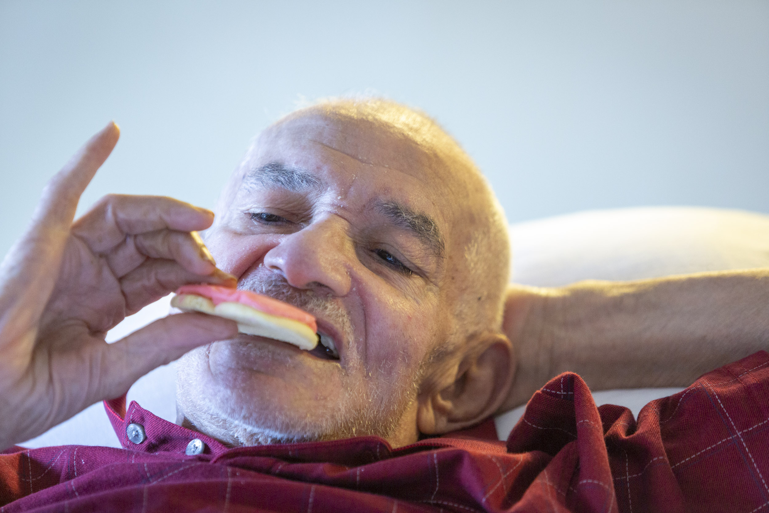  A military veteran takes a bite of a cookie from Cheryl's Cookies at the Armed Forces Retirement Home on Valentine’s Day on Thursday, Feb. 14, 2019 in Washington, DC. 