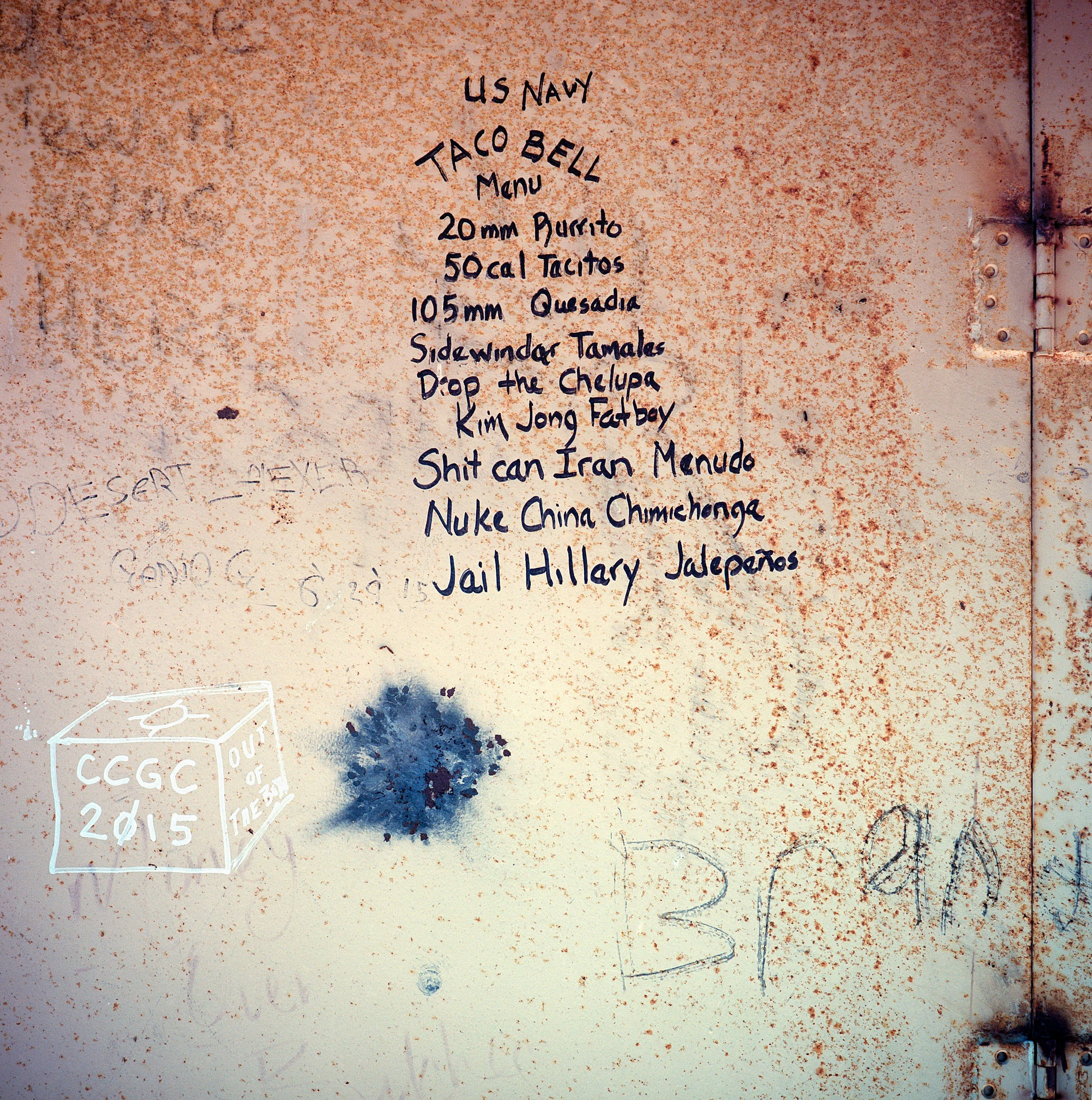 Graffiti covers a metal wall inside a target structure at the Dixie Valey Naval Training Area. The valley was acquired from local ranchers by the US Navy for electronic warfare simulation in 1995. The water table is very high in the area and many ranches in fact were beginning to experience sinkholes and subsidence.
