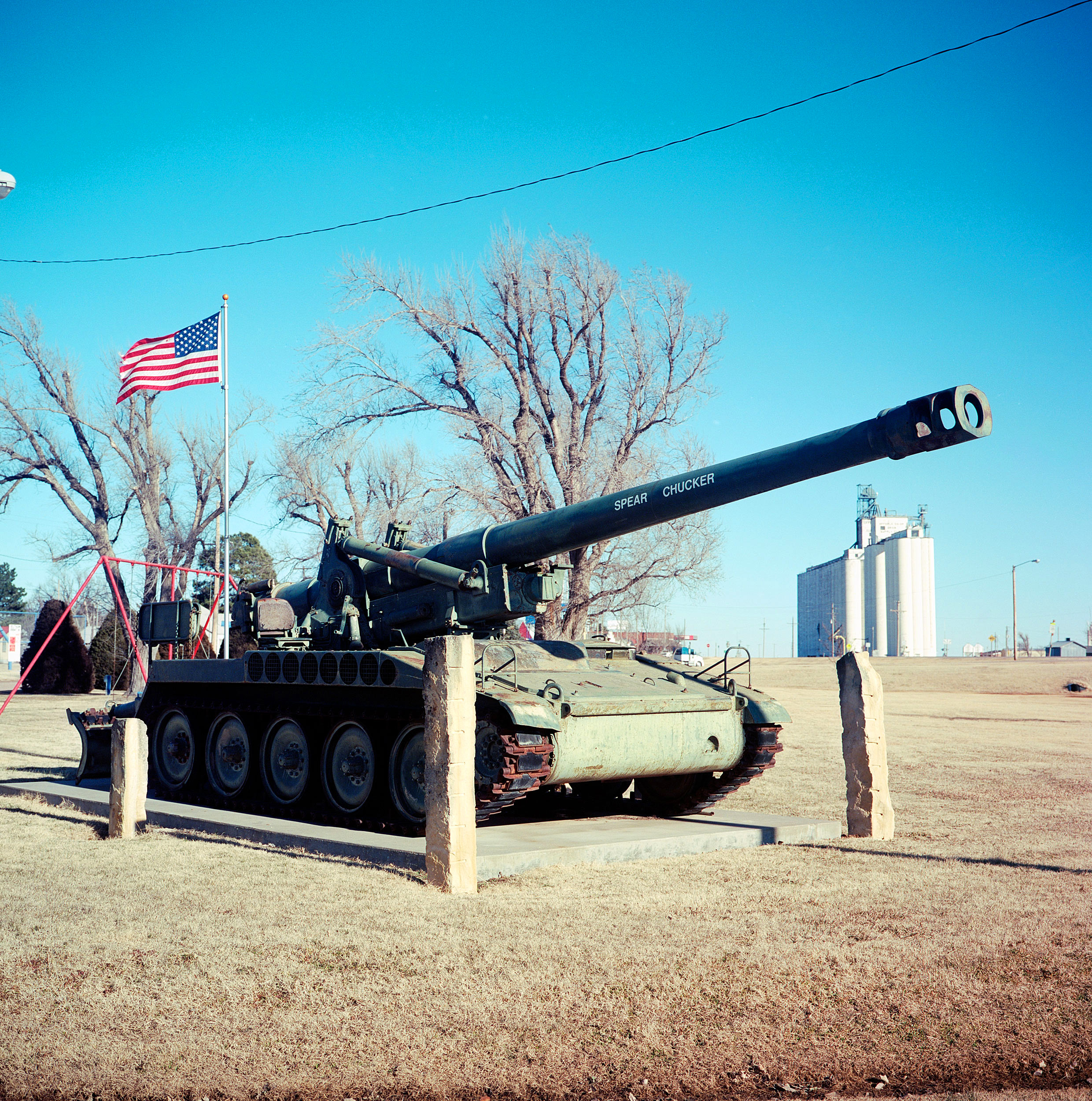  A decommissioned tank with the words “Spear Chucker” on the turret sits in the Offerle, Kansas city park. 