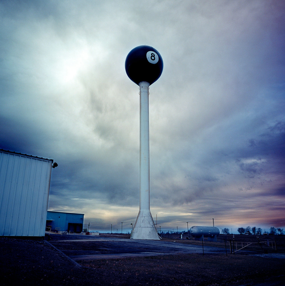  Two views of the 8-ball water tower in Tipton, Missouri. The tower was built by Fisher Manufacturing, which for a time was the biggest maker of billiards tables, to protect its new factory from fire. The plant closed in 1977 and was bought by Fasco 