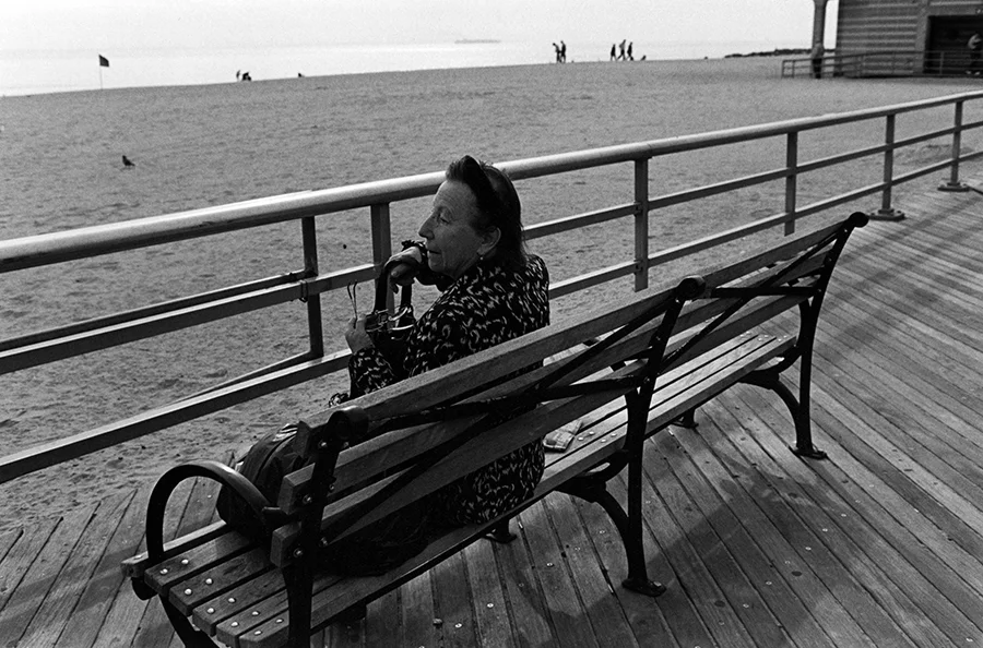 Woman on Boardwalk Bench