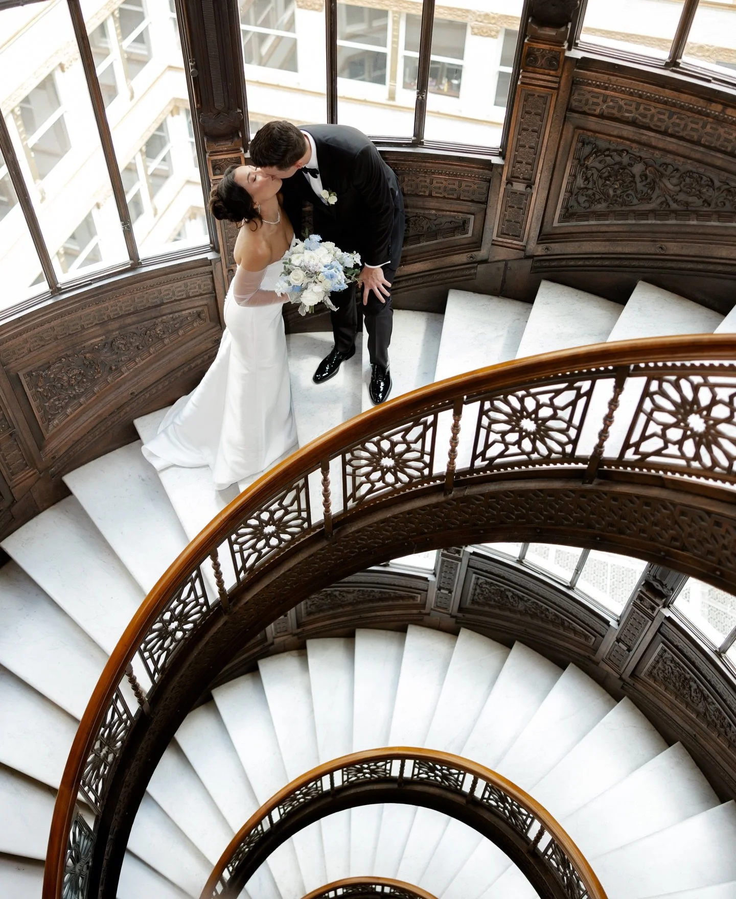 On the famous staircase at The Rookery, she gave him a signet ring. 

#chicagoweddingphotographer #rookerybuilding #therookery #chicagowedding #chicagobride
