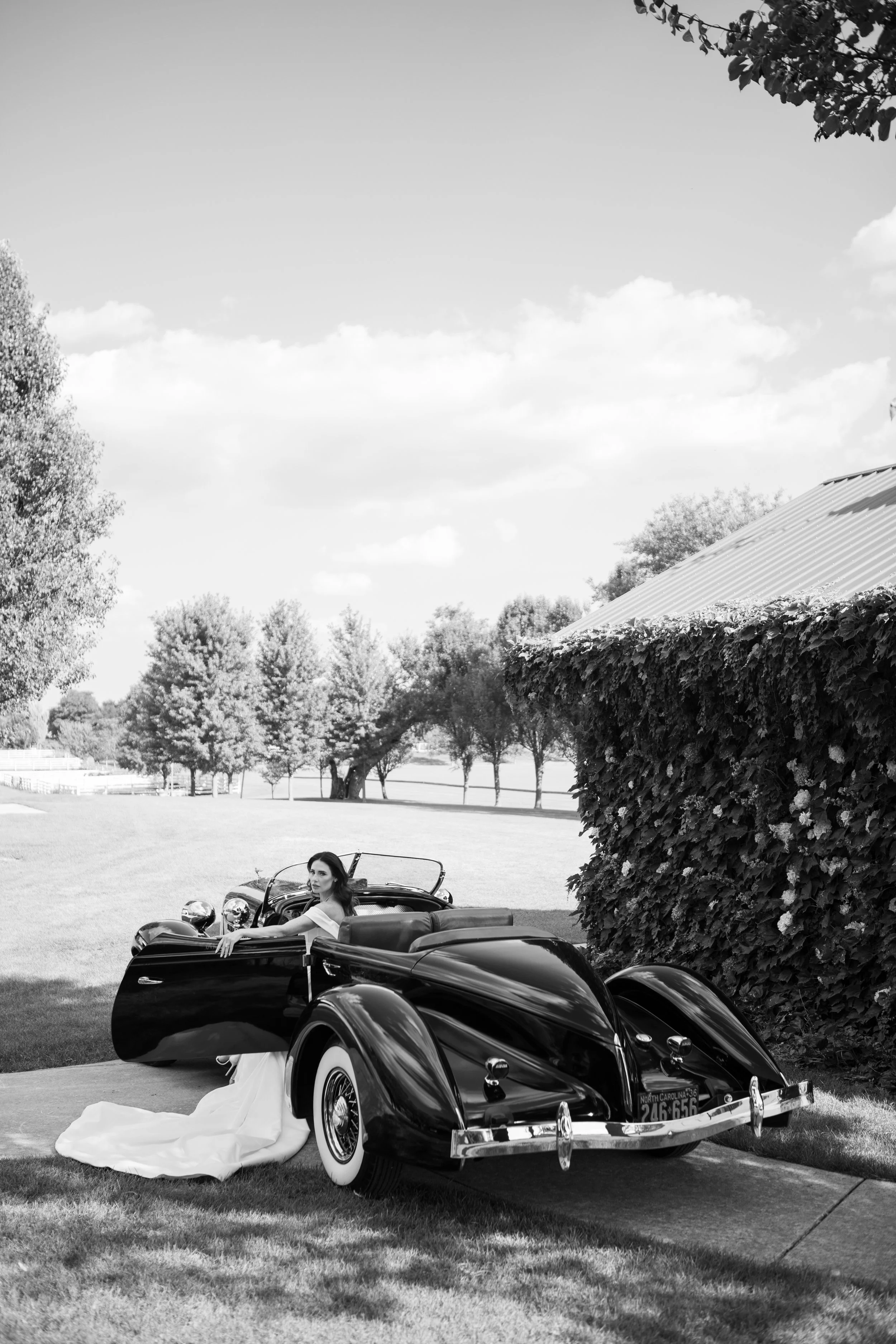 Bride at wedding with car