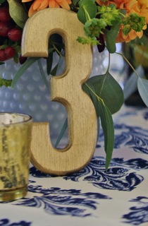 Wooden table numbers-blue stained, gold metallic and walnut stain $3 each number Photo: Michelle Turner
