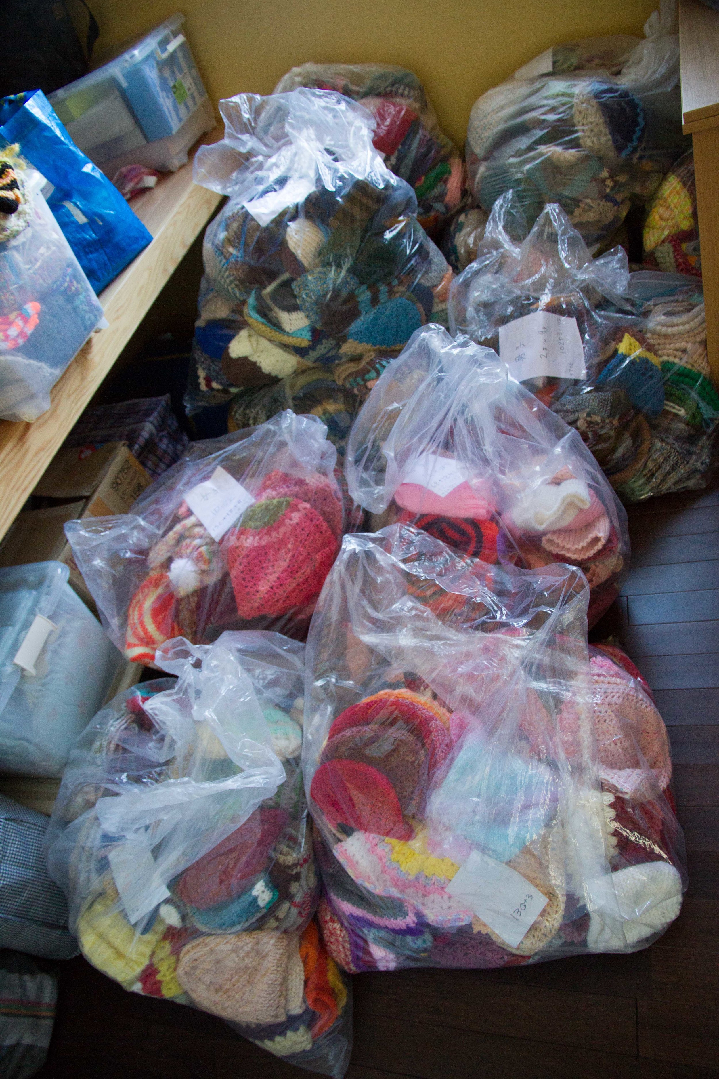 BAGS OF HATS WAITING IN STORAGE ROOM_ i would use this first before showing all the hats on display.jpg